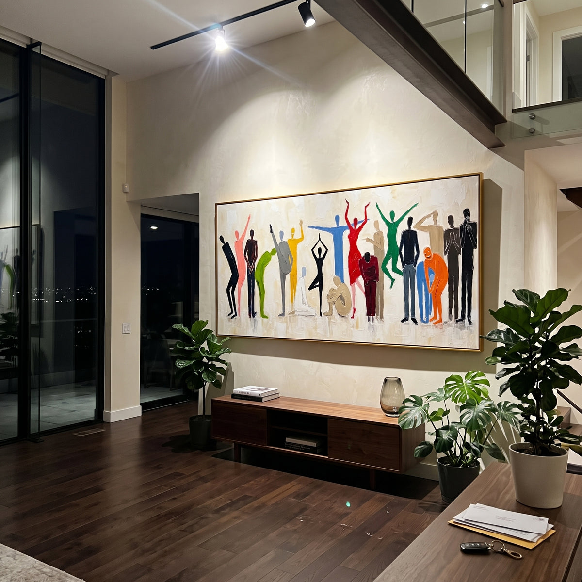 This 100% hand-painted abstract artwork features this hand-painted horizontal canvas presents a lively group of colorful abstract people silhouettes against a white textured background, with varied gestures, poses, and expressive movement. The artwork combines figurative abstraction with thick palette knife texture, raised impasto surface, and a bright social composition. Its white, blue, and green palette anchors the multicolor figures while keeping the wall piece fresh and modern for living