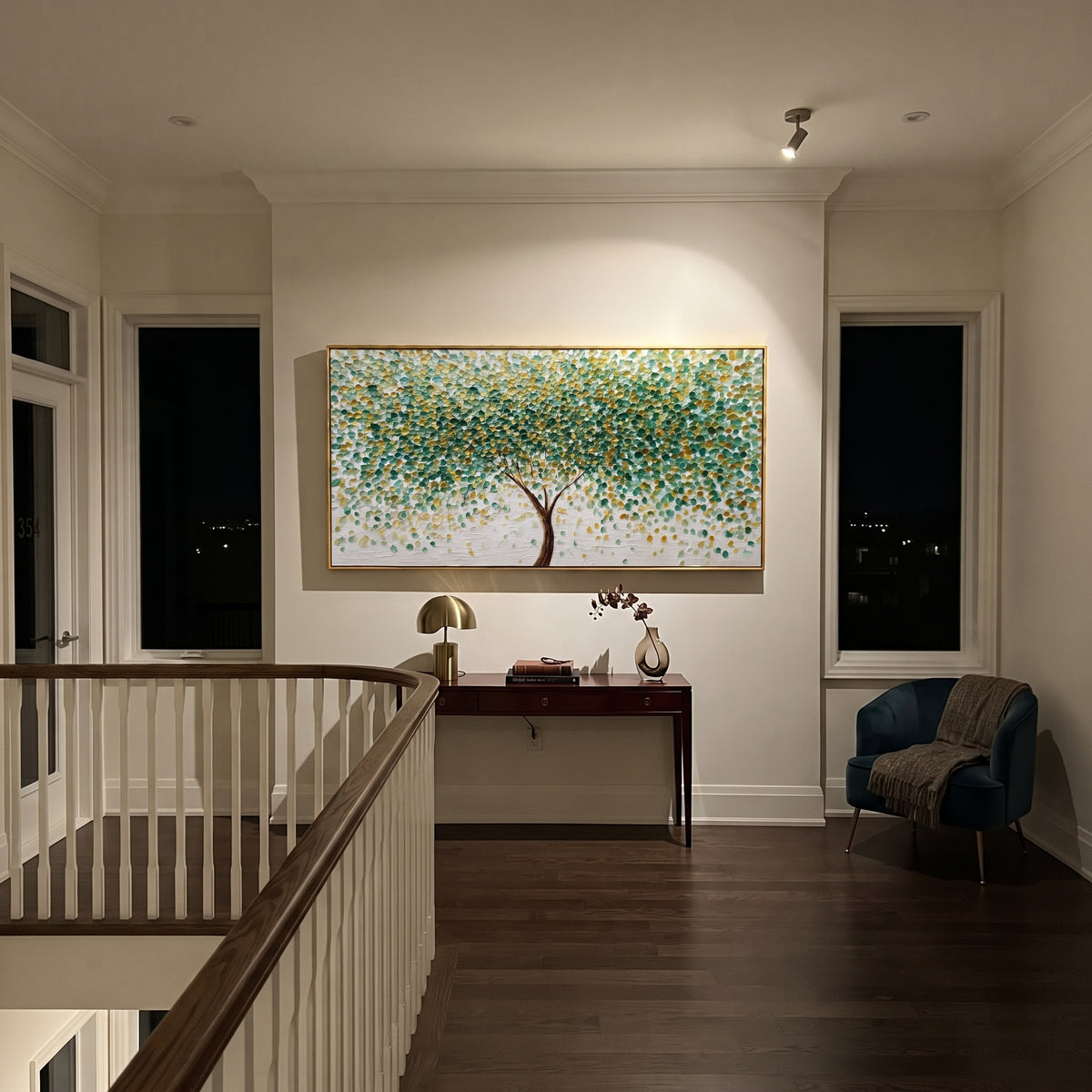 "Round Leaf Tree Painting" focuses on atmosphere, surface movement, and sculptural heavy impasto craftsmanship rather than a fixed literal storyline. The composition uses this hand-painted panoramic canvas shows a centered brown tree with hundreds of small round green and golden leaves, a bright white textured ground, and dot-like impasto marks that create a lively forest canopy effect as the visual anchor, while layered palette-knife paint, raised plaster-like texture, and softened brush