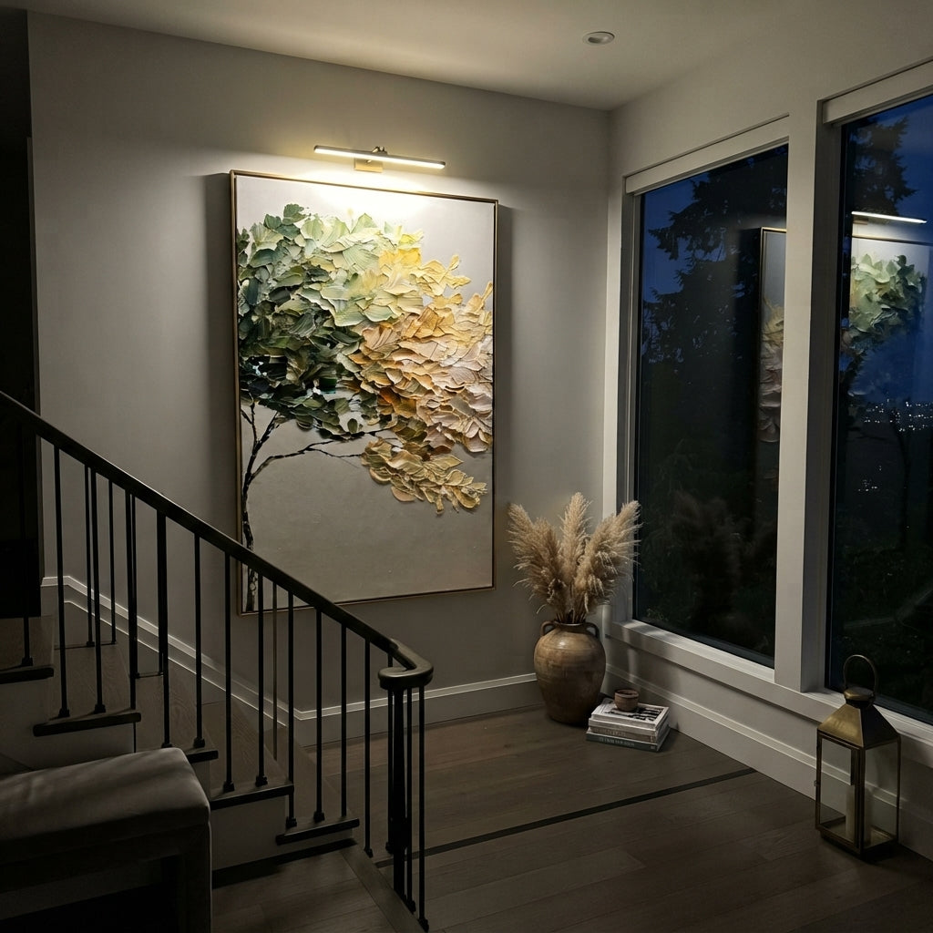 "White Gold Leaning Tree Painting" focuses on atmosphere, surface movement, and sculptural heavy impasto craftsmanship rather than a fixed literal storyline. The composition uses this hand-painted vertical canvas presents a vertical leaning tree with dark green foliage on the left, creamy white and golden leaf mass on the right, and a clean pale background, with visible raised palette-knife paint and handmade surface depth as the visual anchor, while layered palette-knife paint, raised