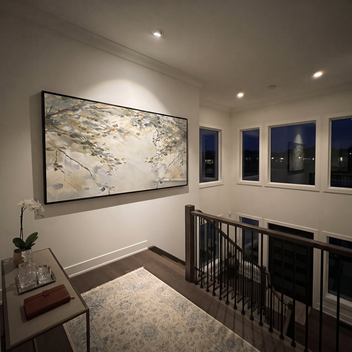 "Soft Branch Leaves Painting" focuses on atmosphere, surface movement, and sculptural heavy impasto craftsmanship rather than a fixed literal storyline. The composition uses this hand-painted panoramic canvas presents pale beige and grey-green branch leaves crossing a light neutral background, with visible raised palette-knife texture and handmade surface depth as the visual anchor, while layered palette-knife paint, raised plaster-like texture, and softened brush movement create tactile depth