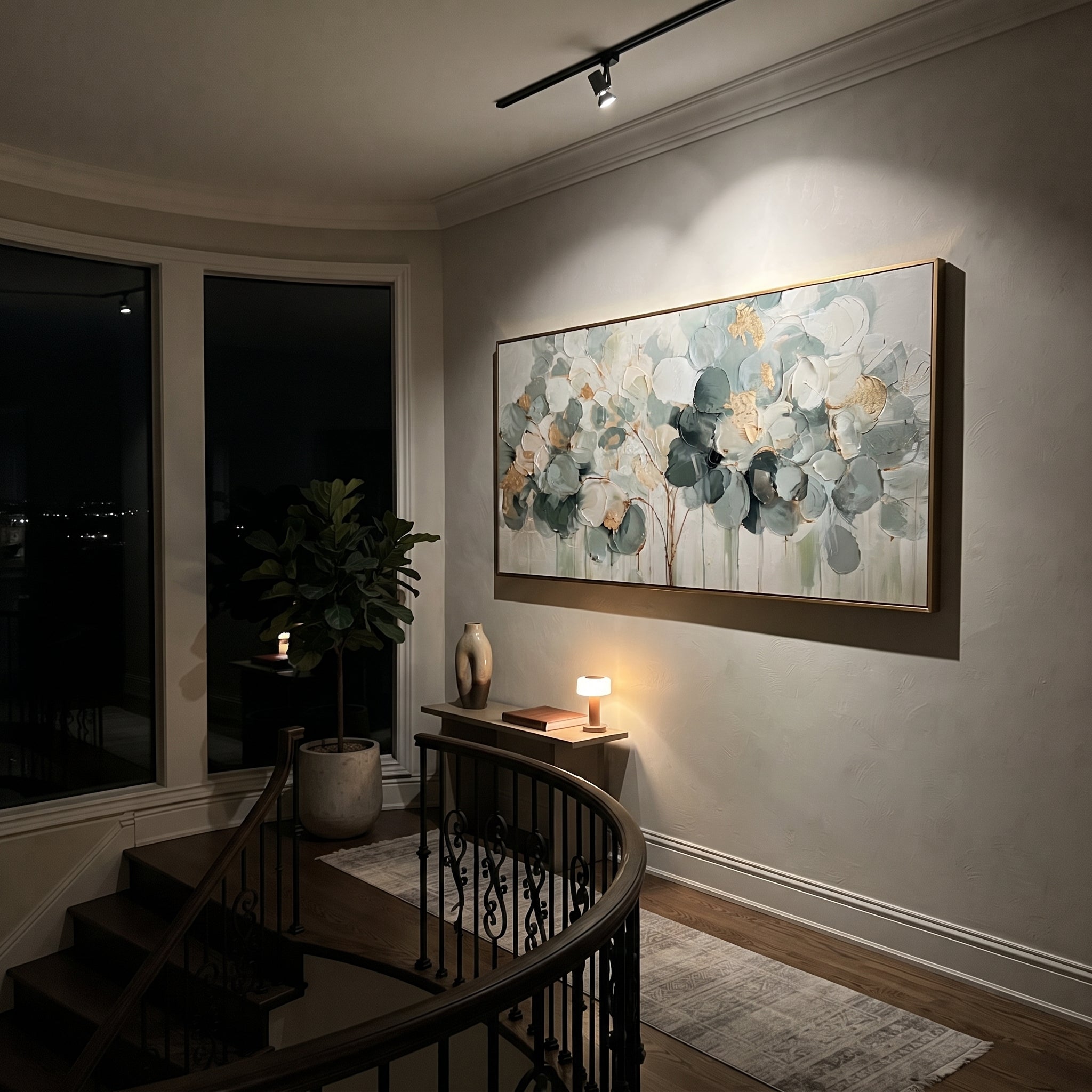 "Sage Green Round Leaf Painting" focuses on atmosphere, surface movement, and sculptural heavy impasto craftsmanship rather than a fixed literal storyline. The composition uses this hand-painted panoramic canvas presents a horizontal round-leaf branch cluster in sage green, cream, dark green, and soft gold over a neutral ground, with visible raised palette-knife texture and handmade surface depth as the visual anchor, while layered palette-knife paint, raised plaster-like texture, and softened