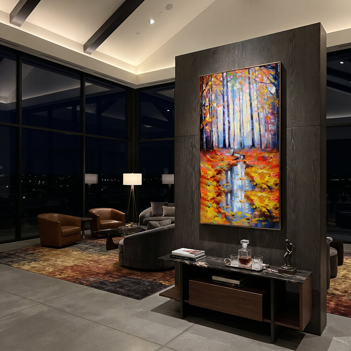 "Autumn Forest Reflection Painting" focuses on atmosphere, surface movement, and sculptural heavy impasto craftsmanship rather than a fixed literal storyline. The composition uses this hand-painted vertical canvas presents pale blue forest trunks above a narrow water reflection, framed by orange and yellow autumn leaves with thick palette-knife texture as the visual anchor, while layered palette-knife paint, raised plaster-like texture, and softened brush movement create tactile depth across the