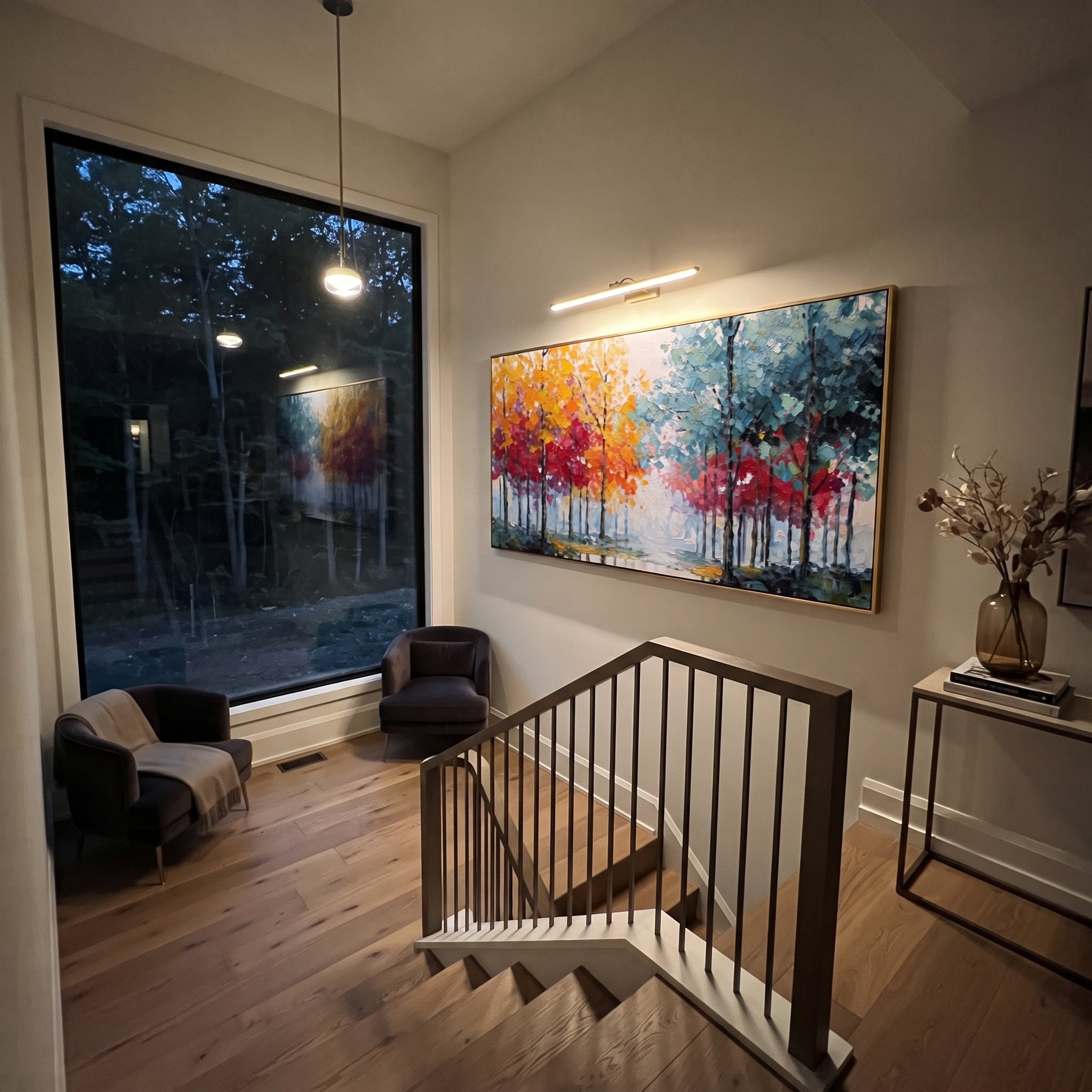 "Rainbow Tree Line Painting" focuses on atmosphere, surface movement, and sculptural heavy impasto craftsmanship rather than a fixed literal storyline. The composition uses this hand-painted panoramic canvas presents a panoramic row of slender trees with yellow orange and red foliage on the left, cool teal blue trees on the right, and a pale misty opening in the center as the visual anchor, while layered palette-knife paint, raised plaster-like texture, and softened brush movement create tactile