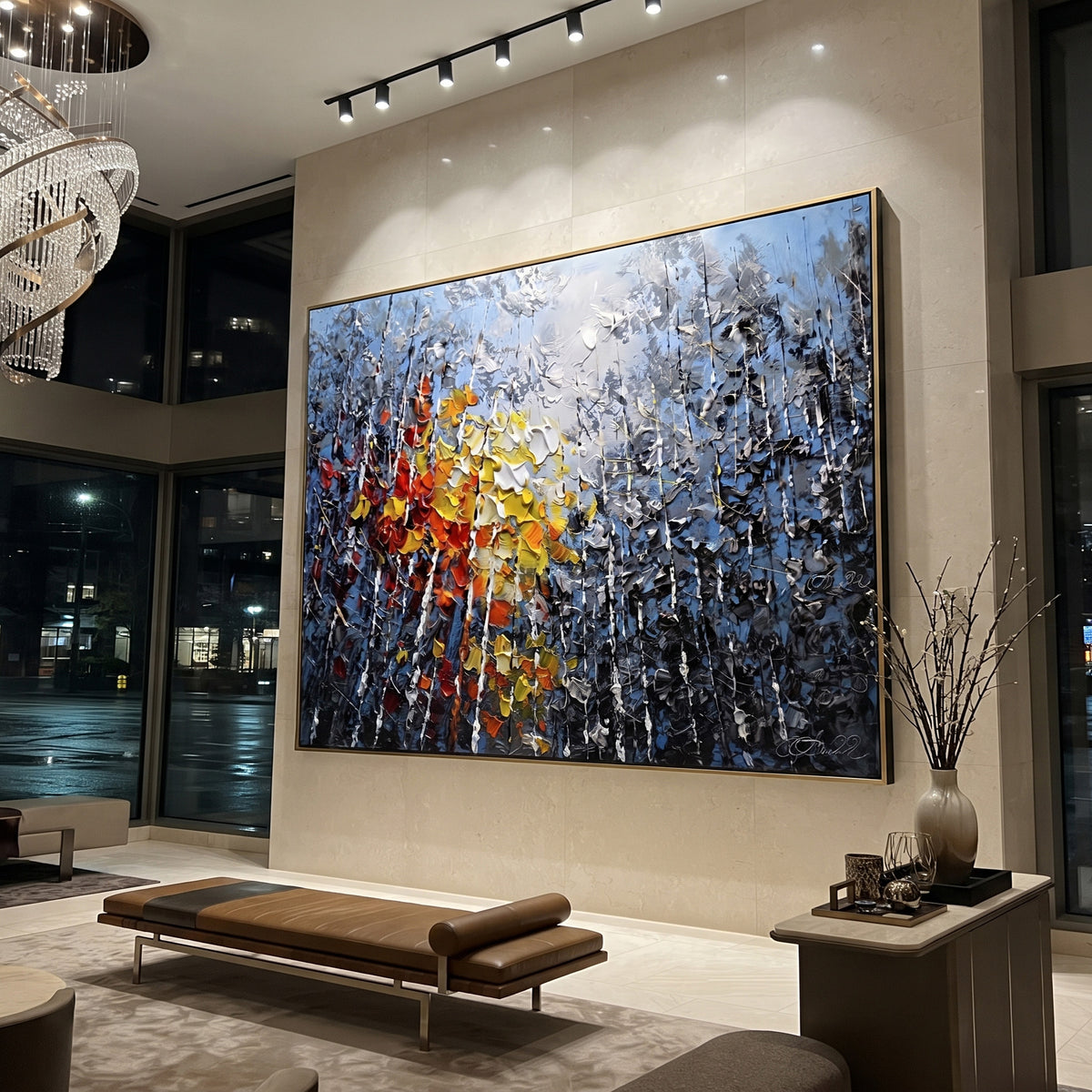 "Sunlit Lake Birch Painting" focuses on atmosphere, surface movement, and sculptural heavy impasto craftsmanship rather than a fixed literal storyline. The composition uses this hand-painted horizontal canvas presents a silver mountain lake with pale blue sky, a bright textured sun, black and white birch trunks, and red orange autumn leaves rising from the foreground as the visual anchor, while layered palette-knife paint, raised plaster-like texture, and softened brush movement create tactile