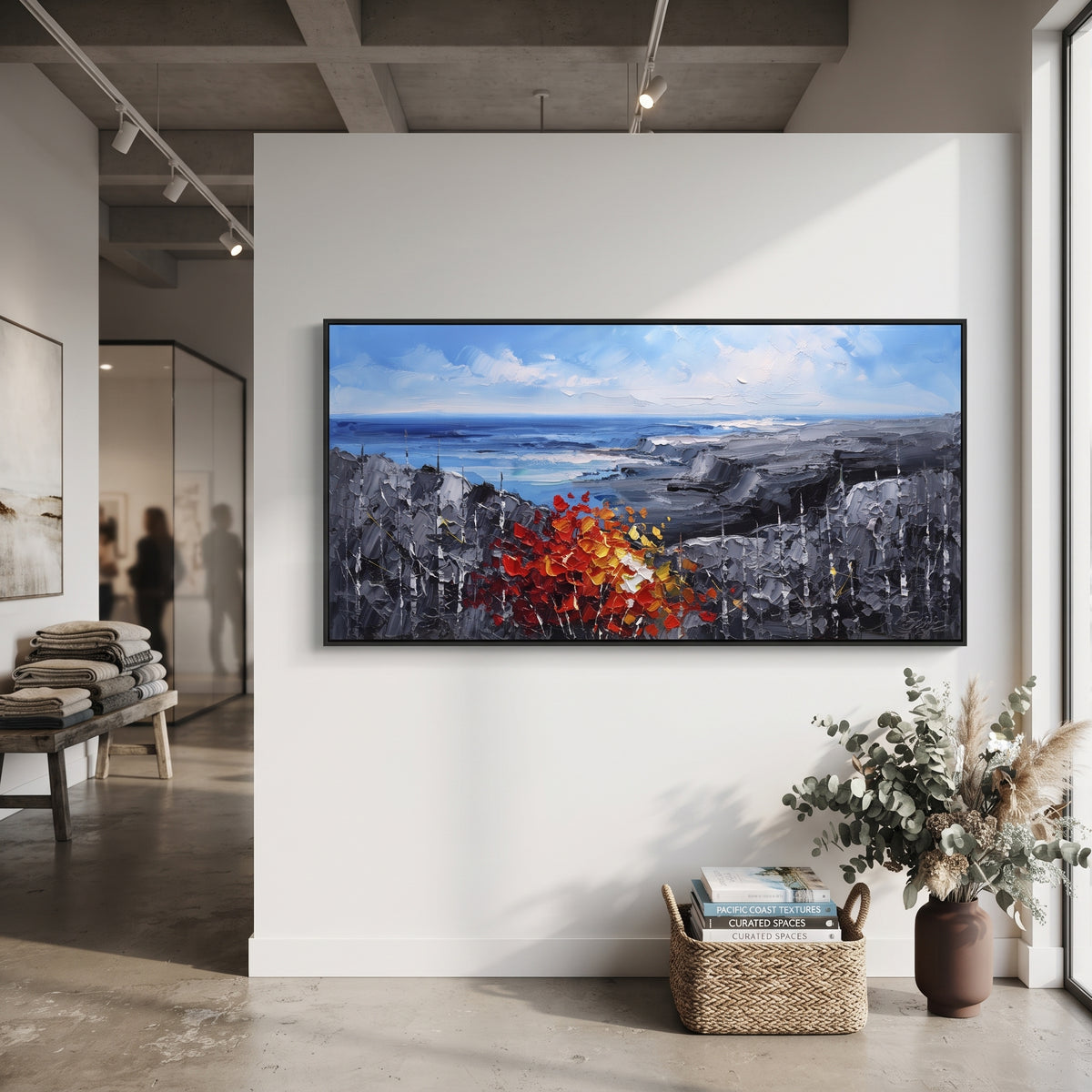"Blue Coast Autumn Painting" focuses on atmosphere, surface movement, and sculptural heavy impasto craftsmanship rather than a fixed literal storyline. The composition uses this hand-painted panoramic canvas shows an open blue shoreline and grey rocky headlands, anchored by a thick red orange autumn tree and dark textured woodland in the foreground as the visual anchor, while layered palette-knife paint, raised plaster-like texture, and softened brush movement create tactile depth across the
