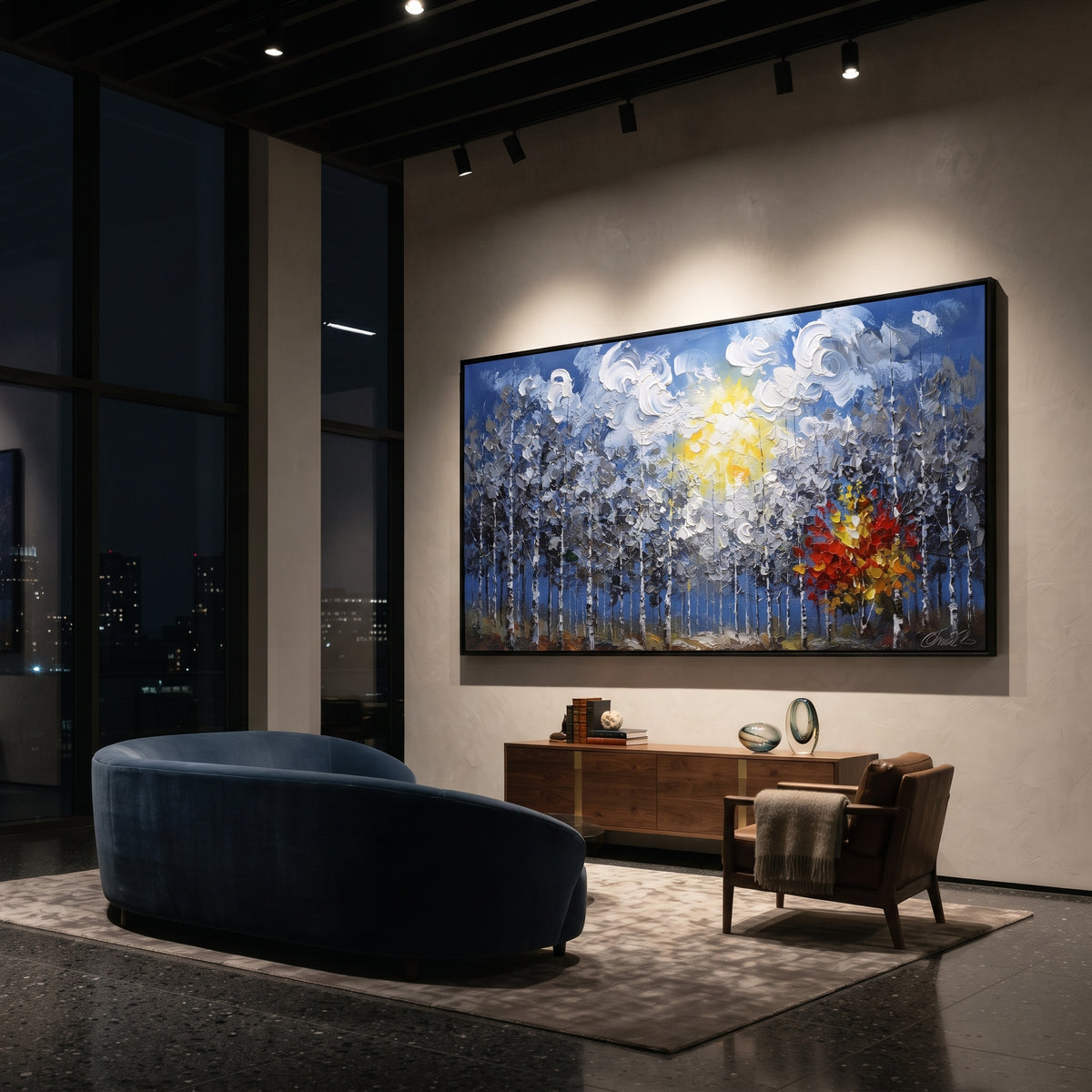 "Blue Forest Sunburst Painting" focuses on atmosphere, surface movement, and sculptural heavy impasto craftsmanship rather than a fixed literal storyline. The composition uses this hand-painted panoramic canvas features a blue birch forest under swirling white clouds and a yellow sun, with one red orange autumn tree glowing against cool grey textured woods as the visual anchor, while layered palette-knife paint, raised plaster-like texture, and softened brush movement create tactile depth across