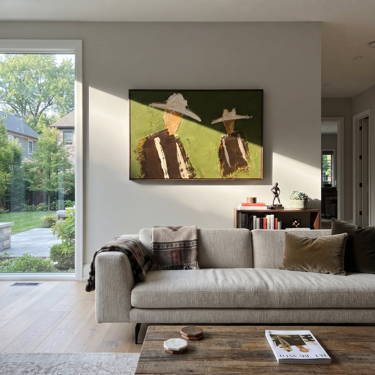 "Separated Cowboy Duo Painting" focuses on atmosphere, surface movement, and sculptural heavy impasto craftsmanship rather than a fixed literal storyline. The composition uses this hand-painted horizontal canvas places two cowboys apart on an olive green plaster field, each wearing a broad cream hat and dark brown western jacket as the visual anchor, while layered palette-knife paint, raised plaster-like texture, and softened brush movement create tactile depth across the canvas. Curated with a