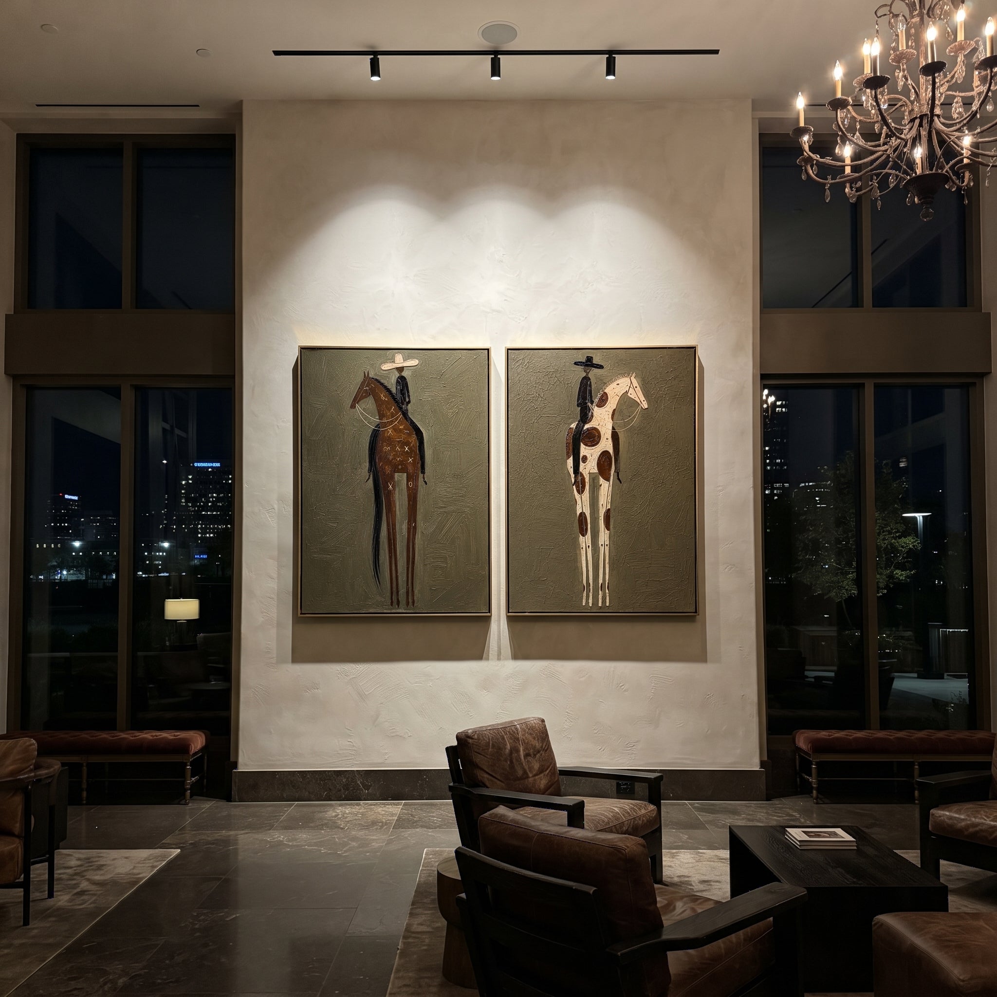 "Tall Spotted Horse Duo Painting" focuses on atmosphere, surface movement, and sculptural heavy impasto craftsmanship rather than a fixed literal storyline. The composition uses this hand-painted horizontal canvas pairs two tall western horse panels, alternating brown and cream spotted horses with slim riders in pale and black hats as the visual anchor, while layered palette-knife paint, raised plaster-like texture, and softened brush movement create tactile depth across the canvas. Curated with