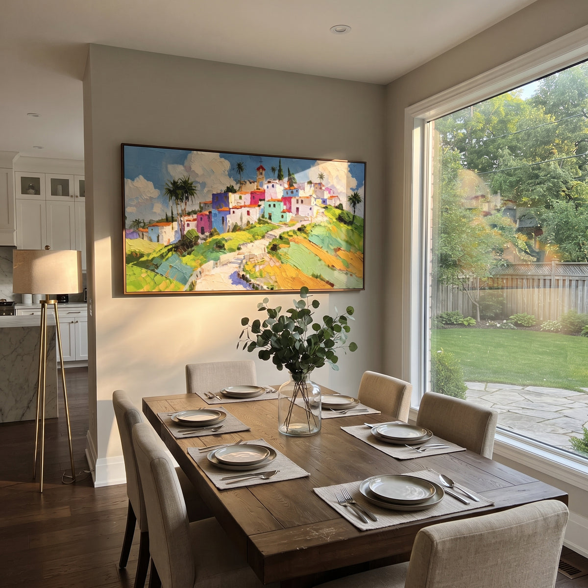 "Harbor Village Reflections PT 1573" focuses on atmosphere, surface movement, and sculptural heavy impasto craftsmanship rather than a fixed literal storyline. The composition uses this hand-painted Mediterranean canvas features colorful waterfront houses, moored boats, shimmering blue harbor reflections, pastel sky, built with raised palette-knife texture, layered brushwork, and luminous coastal color as the visual anchor, while layered palette-knife paint, raised plaster-like texture, and