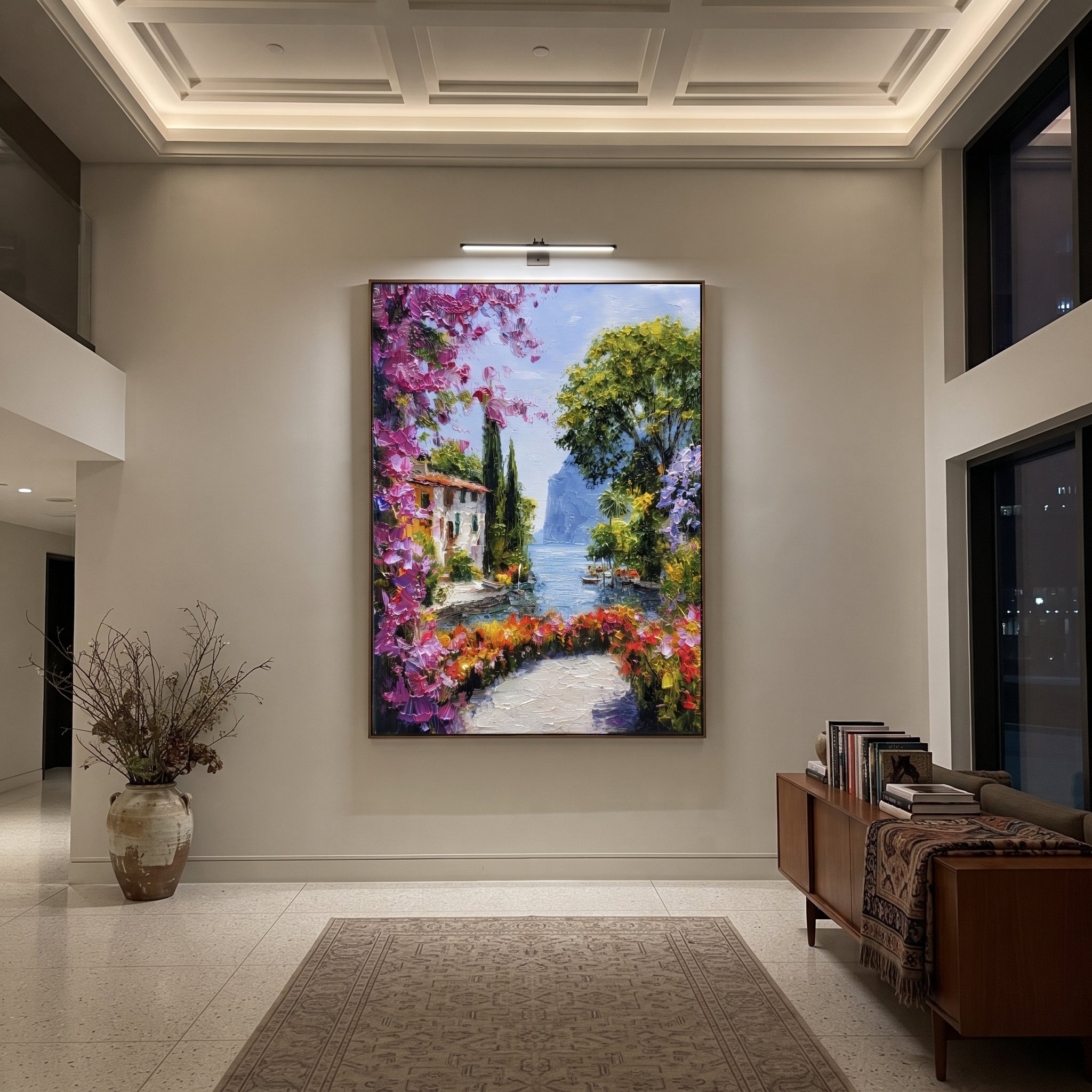 "Mediterranean Floral Passage Painting" focuses on atmosphere, surface movement, and sculptural heavy impasto craftsmanship rather than a fixed literal storyline. The composition uses this hand-painted Mediterranean canvas features whitewashed stone lane, cascading pink bougainvillea, blue sea opening, sunlit village walls, built with raised palette-knife texture, layered brushwork, and luminous coastal color as the visual anchor, while layered palette-knife paint, raised plaster-like texture