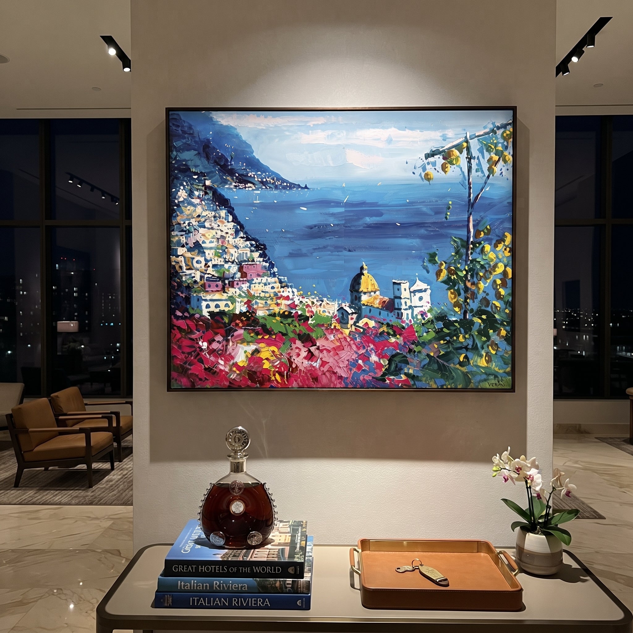 "Cliffside Coastal Vista Coastal with Sailboats Painting" focuses on atmosphere, surface movement, and sculptural heavy impasto craftsmanship rather than a fixed literal storyline. The composition uses this hand-painted Mediterranean canvas features steep coastal cliffs, hillside village, deep blue water, floral foreground, textured sky, built with raised palette-knife texture, layered brushwork, and luminous coastal color as the visual anchor, while layered palette-knife paint, raised