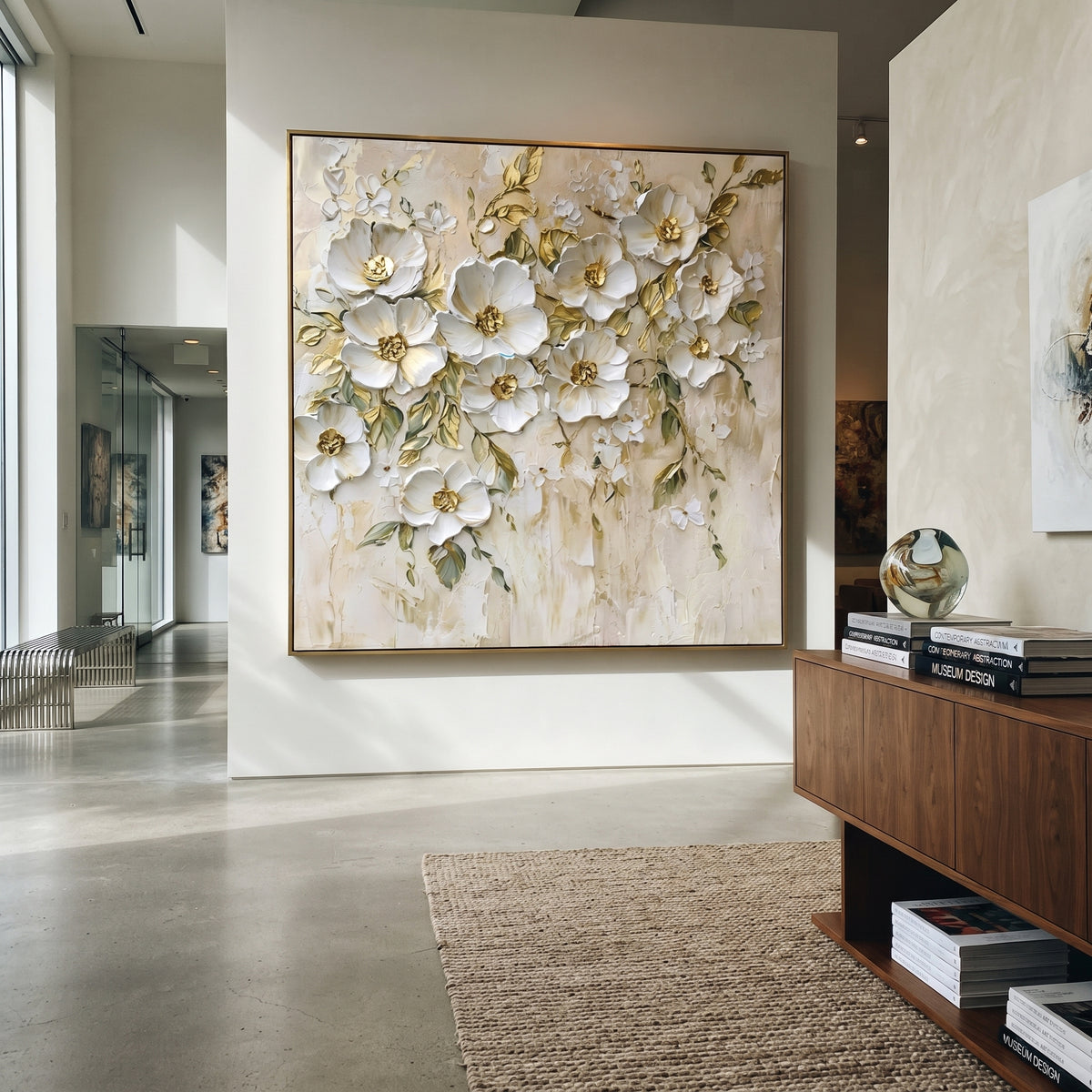 This white botanical blossom relief painting combines raised white flowers, fine green leaf stems, and muted gold centers over a lightly textured ivory ground. The square layout creates a graceful floral wall feature with soft handmade dimension.