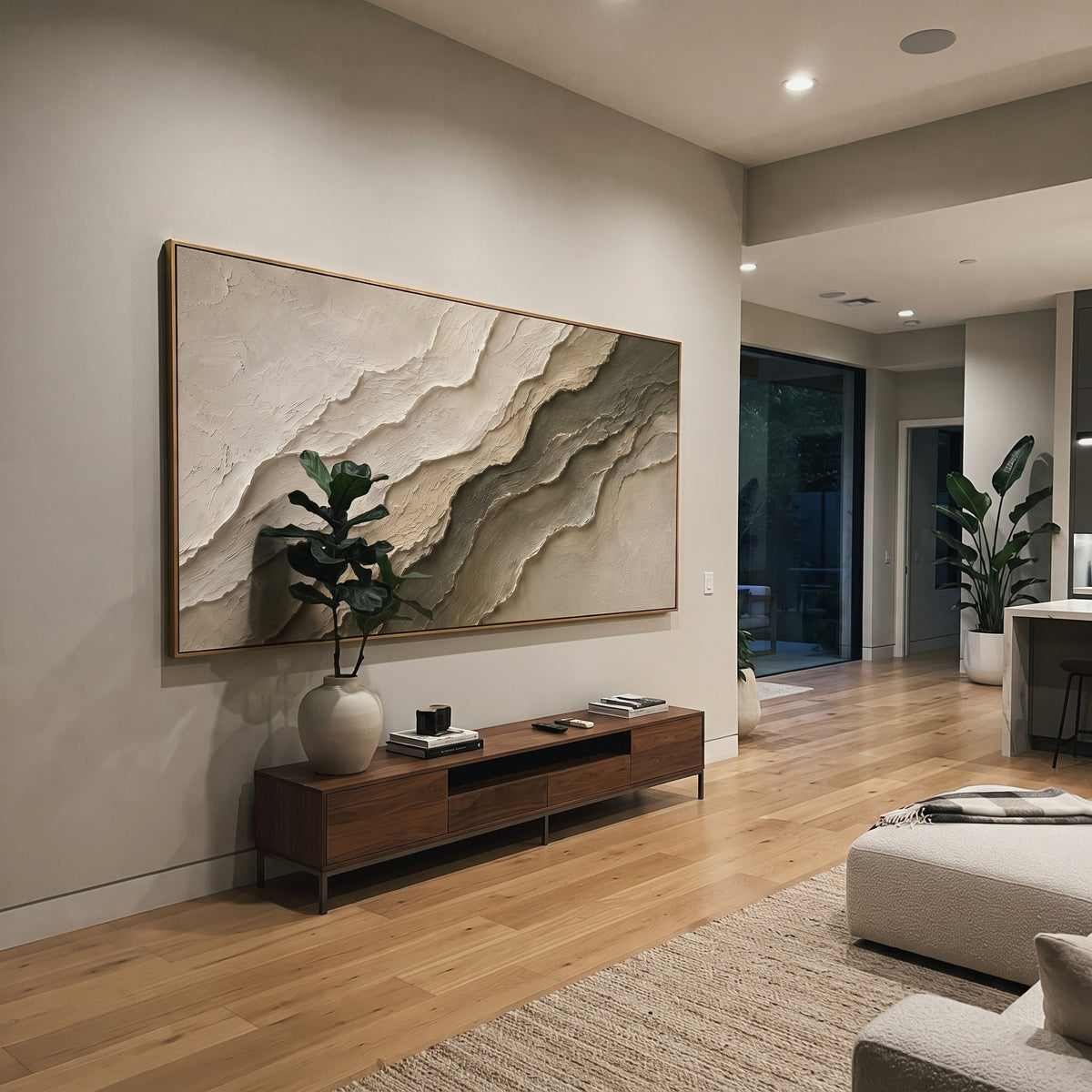 This neutral stratified plaster relief painting uses layered ivory and grey-brown ridges to suggest carved stone strata or quiet terrain. Its wide format and raised handmade texture create a restrained sculptural focal point for modern interiors.