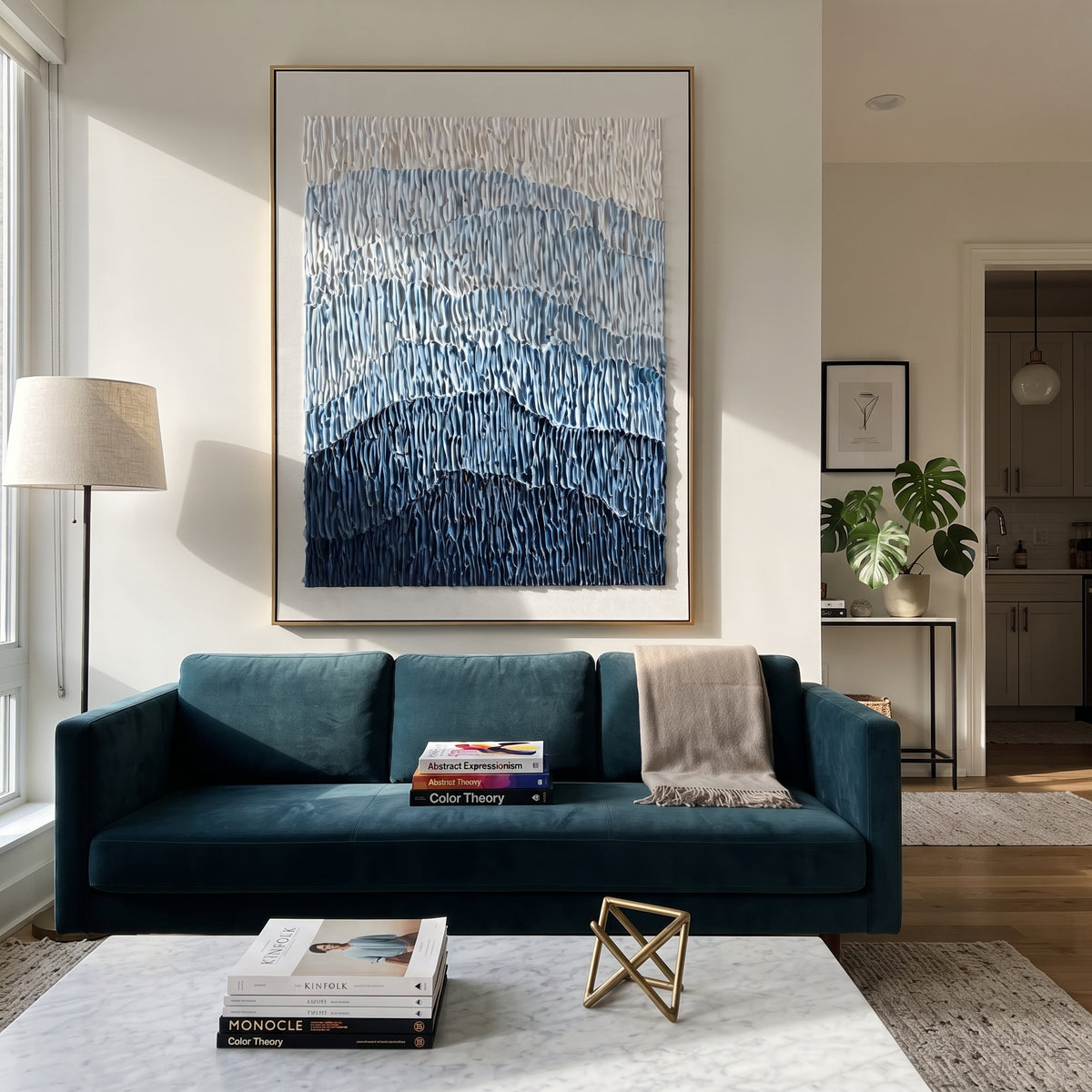 This blue mountain gradient relief painting uses stacked blue bands and vertical combed plaster texture to suggest distant mountains, glaciers, or rolling terrain. Its restrained blue-white palette gives the vertical canvas a calm architectural presence.