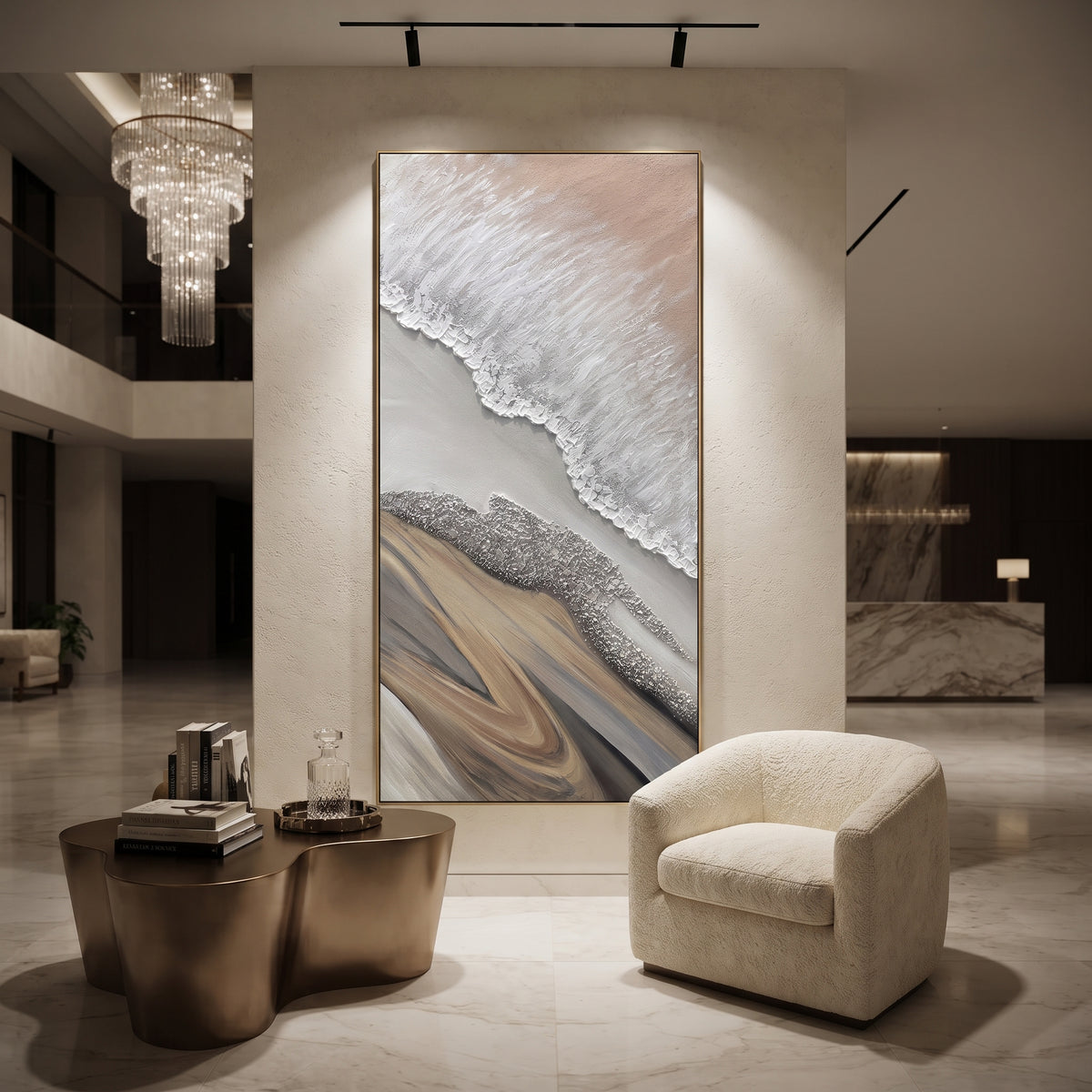This abstract shoreline relief painting uses white raised ridges, grey passages, and sandy beige forms to suggest a quiet coast from above. The vertical format and tactile plaster surface make the piece calm, natural, and architectural.