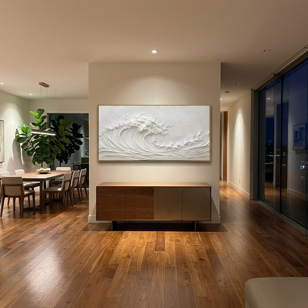 White Rolling Wave Relief focuses on this hand-painted panoramic textured canvas features an all-white curling ocean wave with raised foam, combed surf lines, and minimalist plaster texture across a calm neutral surface. The title and description are matched to the actual main image, so the visible subject, color balance, spacing, and surface movement stay specific to this product instead of using a repeated batch phrase. Raised palette-knife layers, sculpted impasto ridges, softened brush