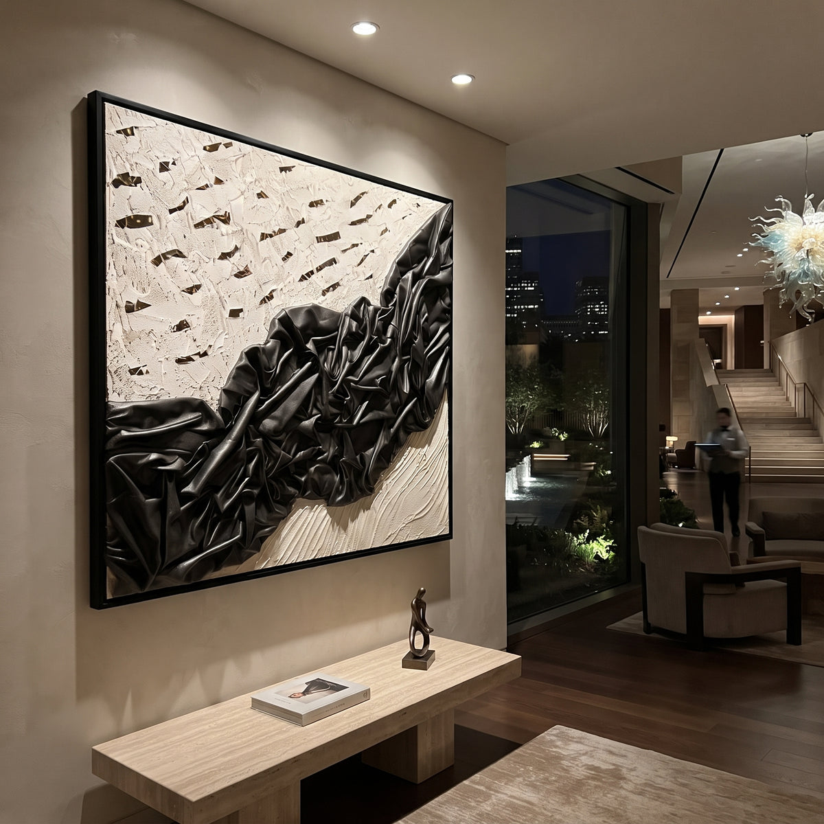 Black Draped Plaster Relief focuses on this hand-painted textured canvas features a dramatic black folded drapery form across a white plaster ground, scattered dark cutout marks, and sculptural fabric-like relief. The composition is described from the actual main image, so the visible subject, color balance, spacing, and surface movement stay specific to this product instead of reading like a batch title. Raised palette-knife layers, sculpted impasto ridges, softened brush transitions, and