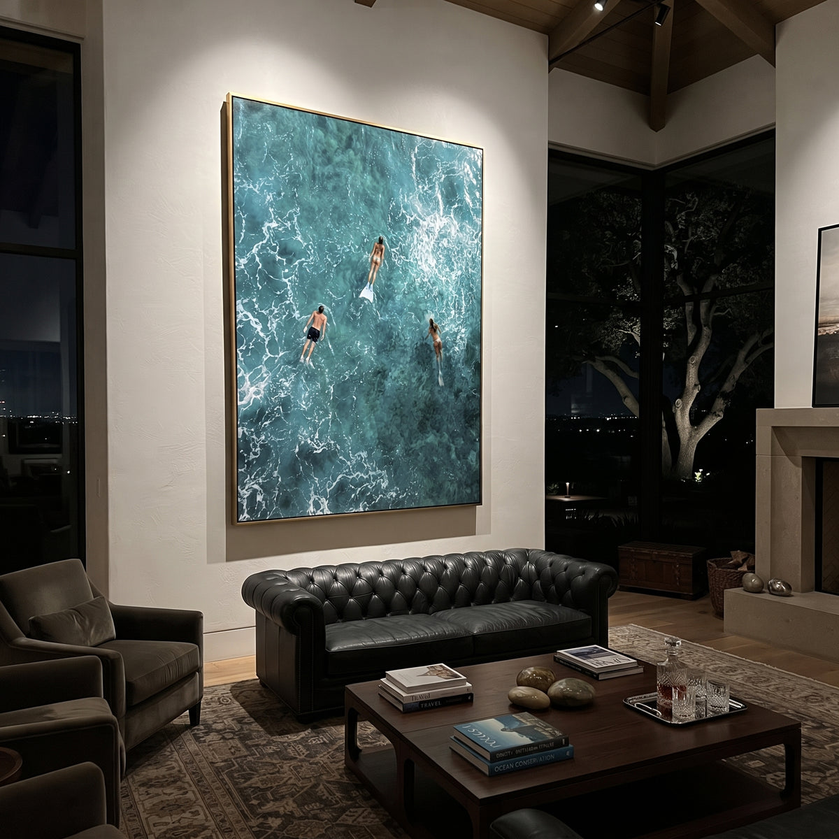 Aerial Blue Swimmers Seascape focuses on this hand-painted textured canvas features aerial turquoise ocean water, white foam tracery, three swimmers with fins, and deep teal underwater movement. The composition is described from the actual main image, so the visible subject, color balance, spacing, and surface movement stay specific to this product instead of reading like a batch title. Raised palette-knife layers, sculpted impasto ridges, softened brush transitions, and tactile handmade texture