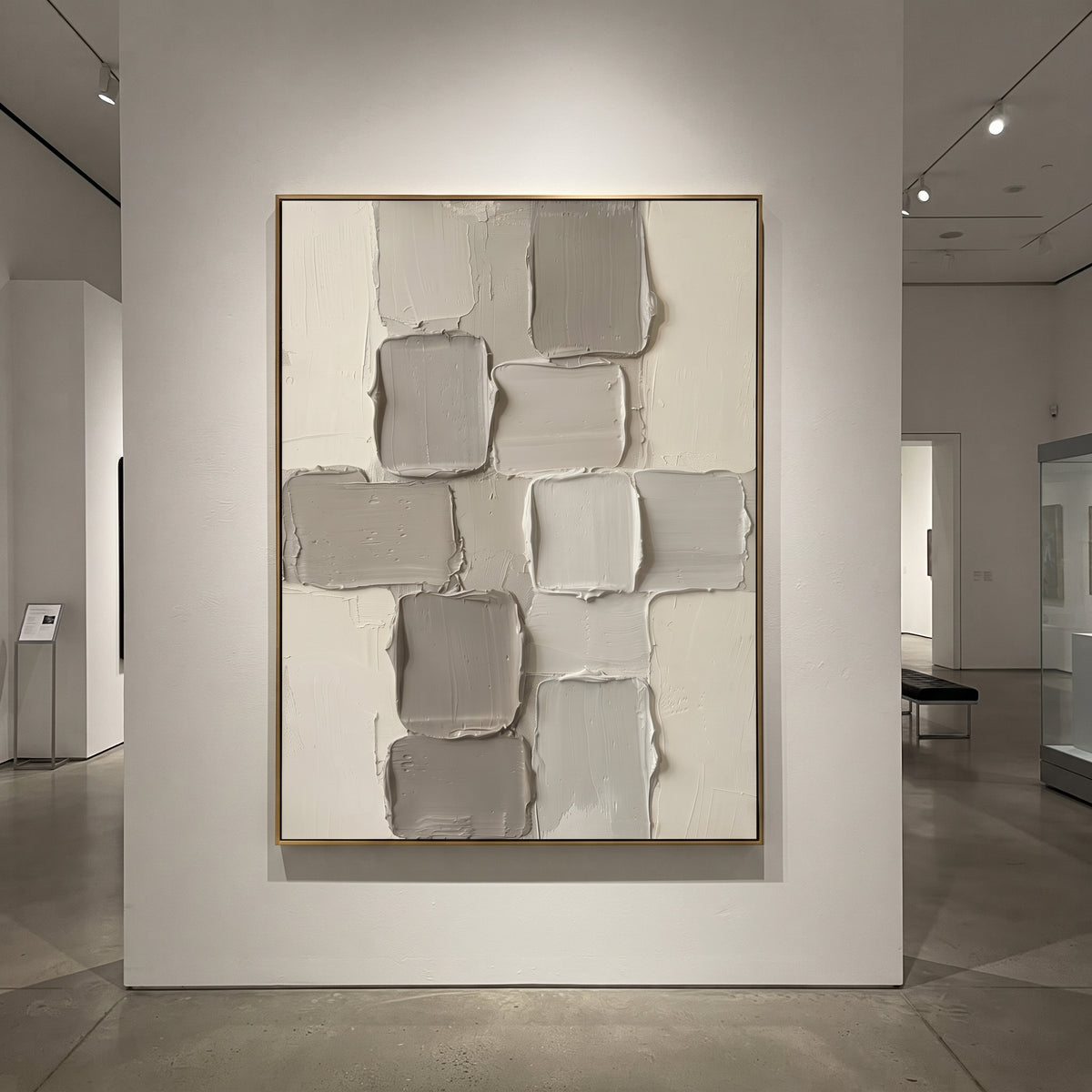 Grey White Block Relief focuses on this hand-painted textured canvas features stacked grey and white rectangular plaster blocks with soft rounded edges and quiet geometric rhythm. The composition is described from the actual main image, so the visible subject, color balance, spacing, and surface movement stay specific to this product instead of reading like a batch title. Raised palette-knife layers, sculpted impasto ridges, softened brush transitions, and tactile handmade texture give the