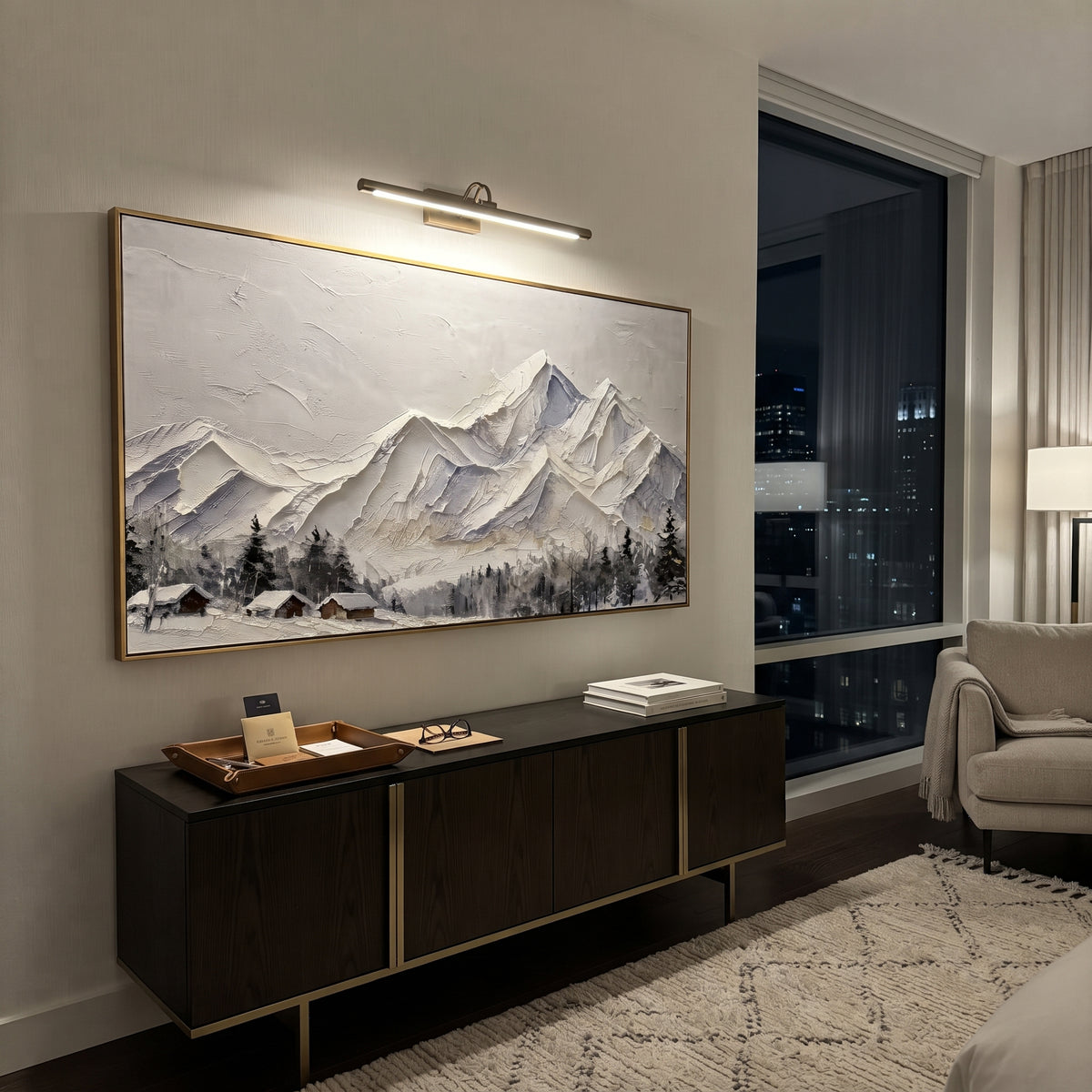 Folded White Summit Range is written from the actual artwork image, focusing on folded white summit range with crisp angular peaks and small dark cabins below. The visible composition is specific rather than generic: sharp folded ridges, pale beige sky, dark roof accents near the lower edge, and sculpted snow planes. The wide horizontal layout controls how the eye travels through the scene, with the mountain mass, valley floor, tree line, water edge, or small figure details arranged to create