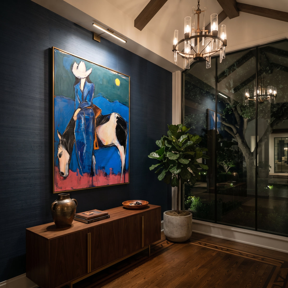 Midnight Blue Horse Rider is written from the actual artwork image, focusing on a blue-clad rider on a white horse beneath a moon over dark desert hills. The composition is built from specific visible details: white horse, blue rider clothing, crescent-like moon, dark hill line, pink ground, and night western mood. The vertical composition keeps attention on white horse, blue rider clothing, crescent-like moon, dark hill line, pink ground, and night western mood, using open ground, cropped