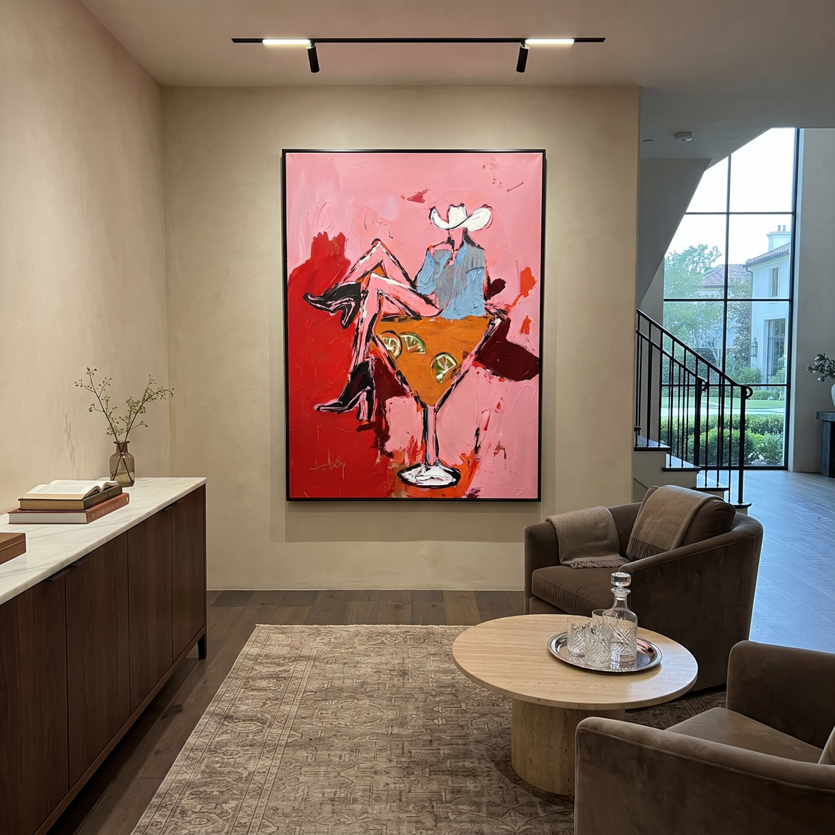 Western Cocktail Bar Cart is written from the actual artwork image, focusing on two cowgirls seated around a giant orange cocktail glass on a pink field. The composition is built from specific visible details: two white hats, orange cocktail glass, red boots, pink field, and bar-cart party composition. The vertical composition keeps attention on two white hats, orange cocktail glass, red boots, pink field, and bar-cart party composition, using open ground, cropped edges, and strong color blocks
