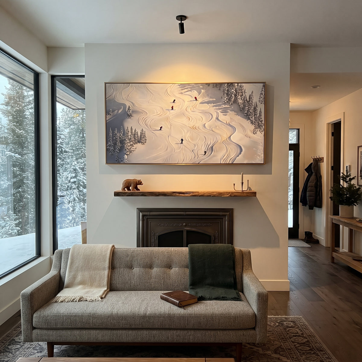 North Ski Traverse focuses on small downhill figures moving over carved impasto snow channels and soft blue shadows. The artwork shows a winter ski scene built from the actual image: visible downhill figures, curved snow tracks, raised ridgelines, and alpine space arranged in a wide composition. The white, black, gray palette gives the piece a cold mountain atmosphere while the thick impasto surface creates shadows along each snowbank, ski line, and textured ridge. This is presented as