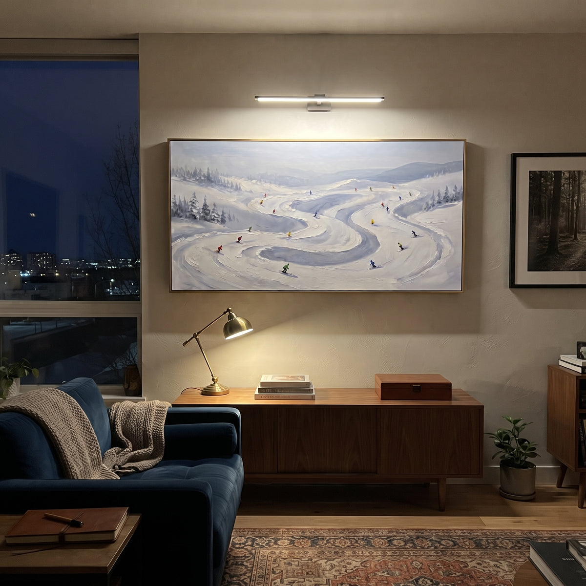 Slope Pine Slope focuses on small downhill figures moving over carved impasto snow channels and soft blue shadows. The artwork shows a winter ski scene built from the actual image: visible downhill figures, curved snow tracks, raised ridgelines, and alpine space arranged in a wide composition. The blue, white, orange palette gives the piece a cold mountain atmosphere while the thick impasto surface creates shadows along each snowbank, ski line, and textured ridge. This is presented as
