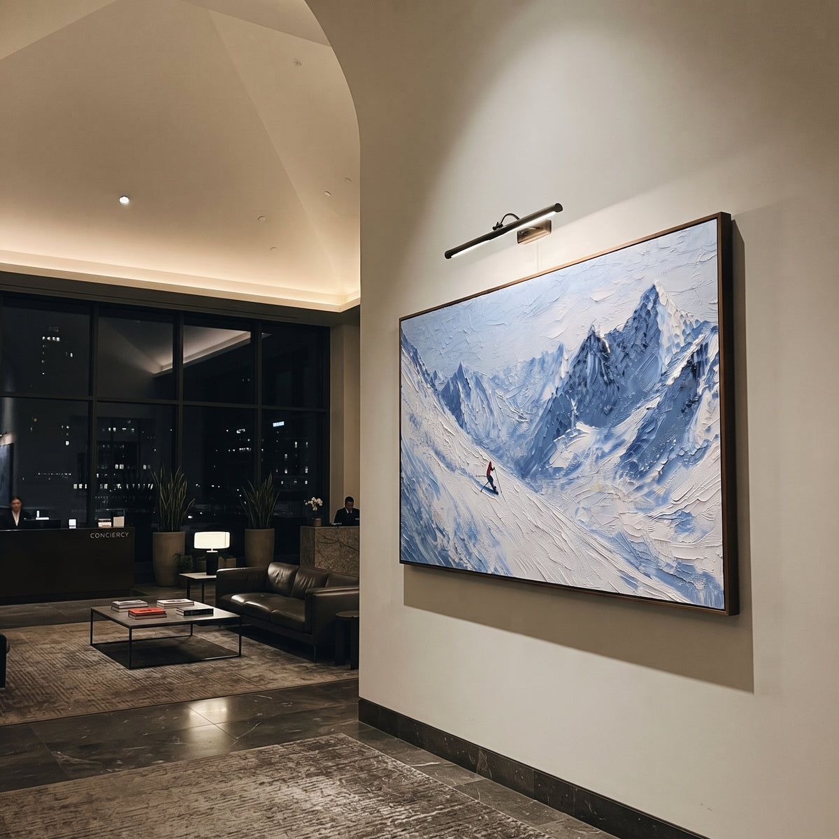 Mountain Ski Traverse focuses on small downhill figures moving over carved impasto snow channels and soft blue shadows. The artwork shows a winter ski scene built from the actual image: visible downhill figures, curved snow tracks, raised ridgelines, and alpine space arranged in a wide composition. The white, gray, blue palette gives the piece a cold mountain atmosphere while the thick impasto surface creates shadows along each snowbank, ski line, and textured ridge. This is presented as