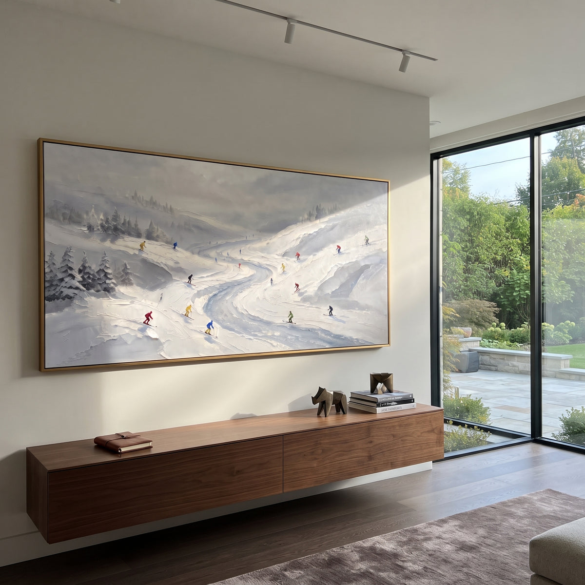 Resort Mountain Run With Pine Shadows focuses on a calm mountain basin with crisp tracks, snow shelves, and small skiers. The artwork shows a winter ski scene built from the actual image: visible downhill figures, curved snow tracks, raised ridgelines, and alpine space arranged in a wide composition. The white, black, gray palette gives the piece a cold mountain atmosphere while the thick impasto surface creates shadows along each snowbank, ski line, and textured ridge. This is presented as