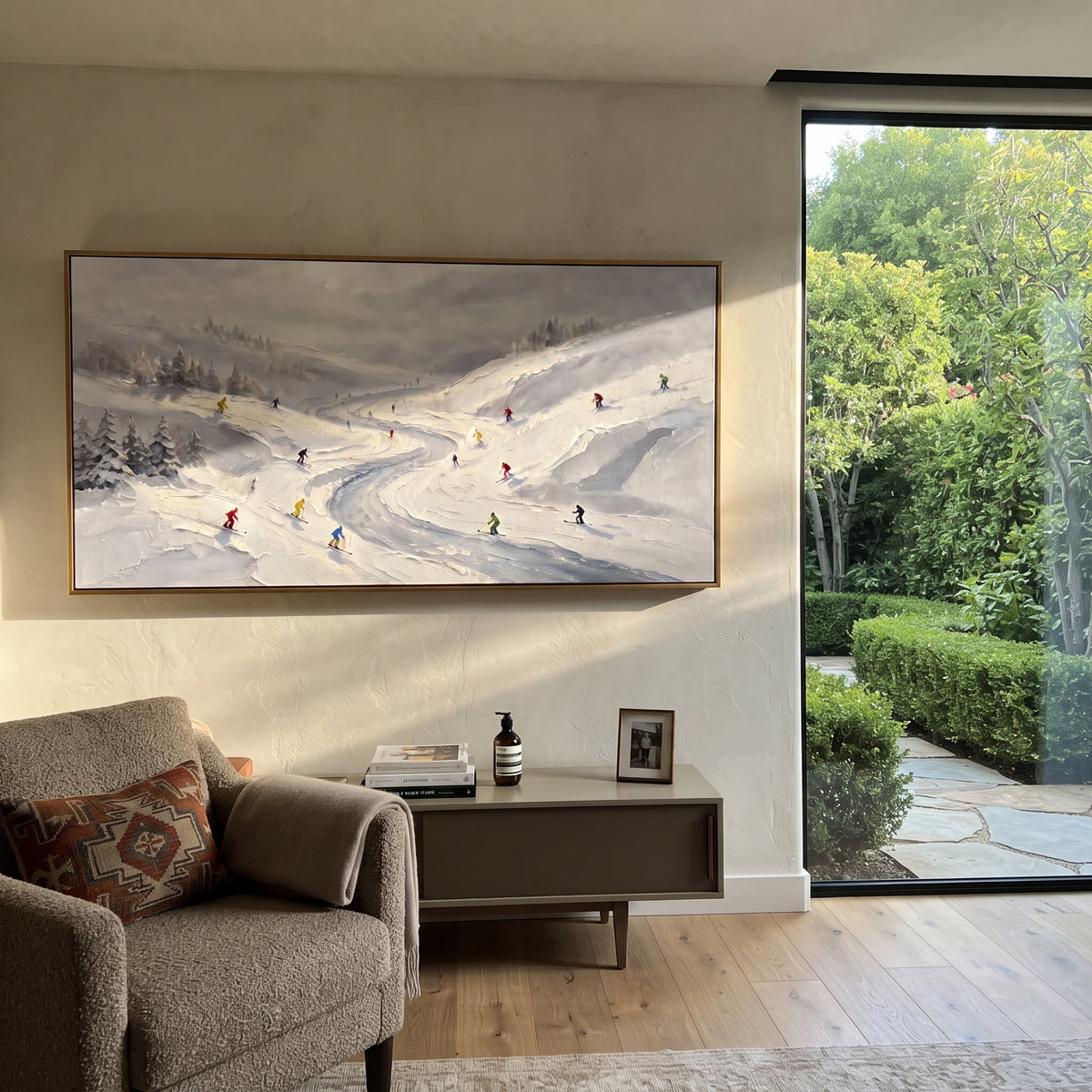 Resort Mountain Run With Pine Shadows focuses on a calm mountain basin with crisp tracks, snow shelves, and small skiers. The artwork shows a winter ski scene built from the actual image: visible downhill figures, curved snow tracks, raised ridgelines, and alpine space arranged in a wide composition. The white, black, gray palette gives the piece a cold mountain atmosphere while the thick impasto surface creates shadows along each snowbank, ski line, and textured ridge. This is presented as