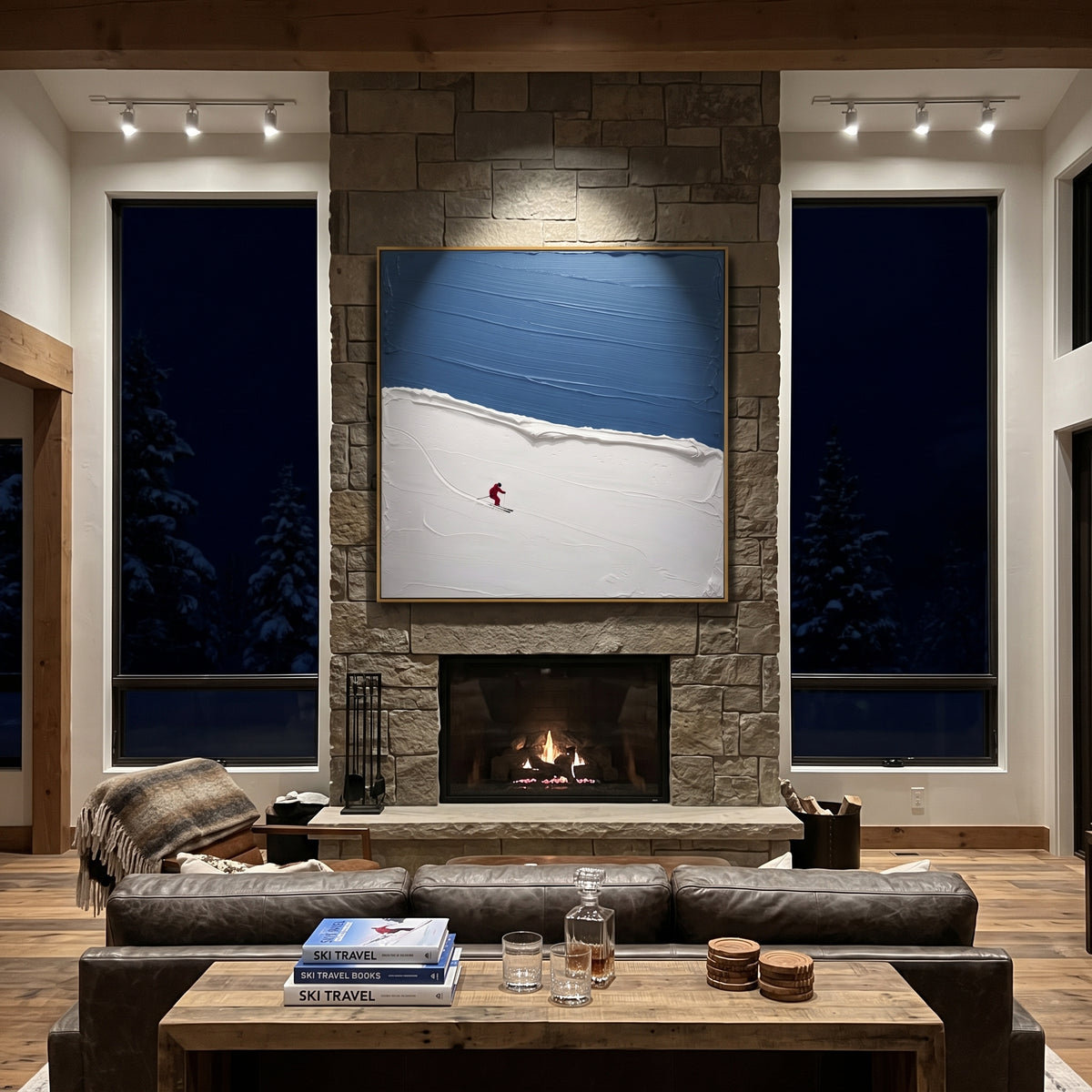 Blue Ridge Solo Skier focuses on one red skier crossing a quiet blue ridge below a deep winter sky. The artwork shows a winter ski scene built from the actual image: visible downhill figures, curved snow tracks, raised ridgelines, and alpine space arranged in a balanced composition. The blue, white, red palette gives the piece a cold mountain atmosphere while the thick impasto surface creates shadows along each snowbank, ski line, and textured ridge. This is presented as hand-painted textured