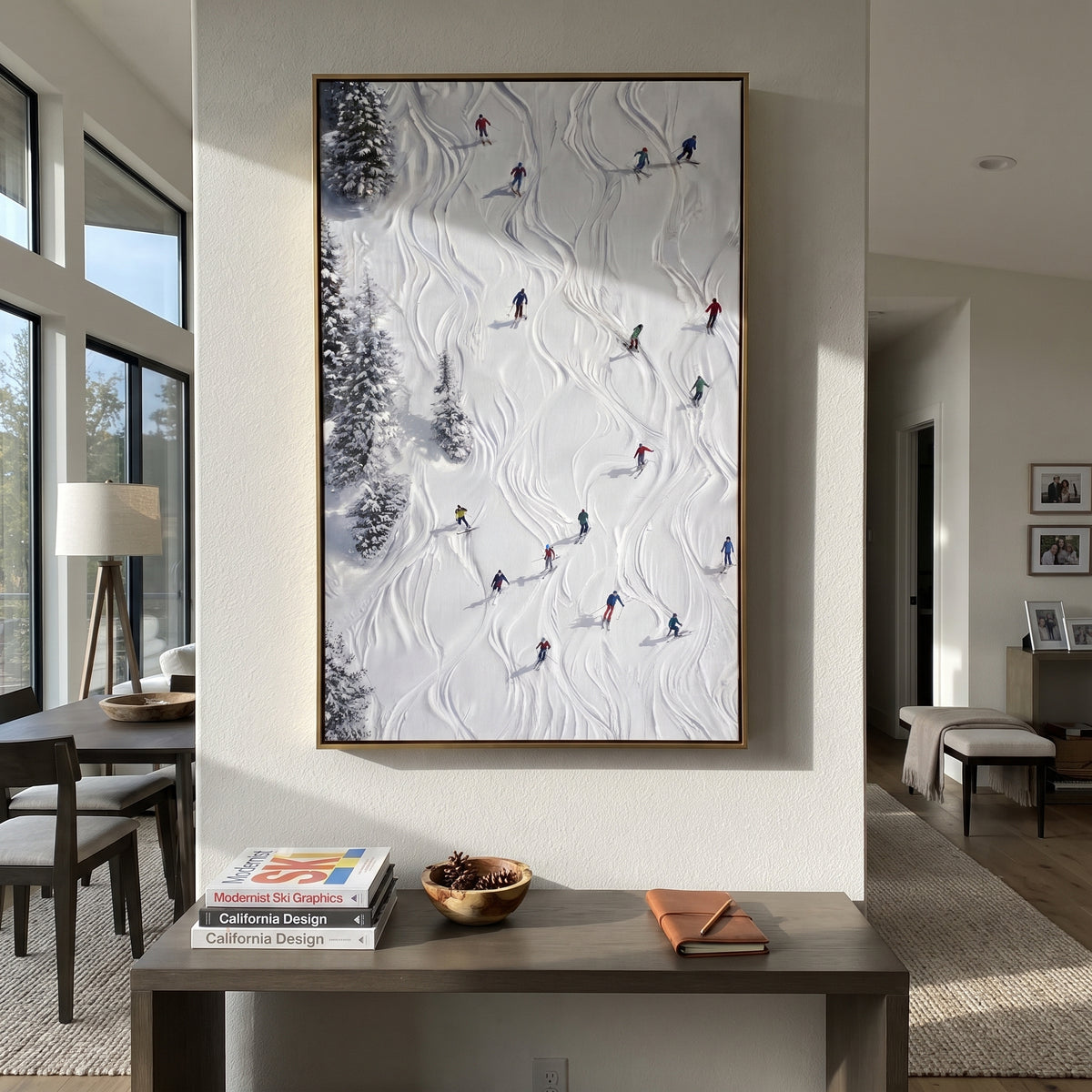 Alpine Pine Slope With Pine Shadows focuses on distant peaks, white powder banks, and raised palette-knife terrain. The artwork shows a winter ski scene built from the actual image: visible downhill figures, curved snow tracks, raised ridgelines, and alpine space arranged in a tall composition. The white, gray, blue palette gives the piece a cold mountain atmosphere while the thick impasto surface creates shadows along each snowbank, ski line, and textured ridge. This is presented as