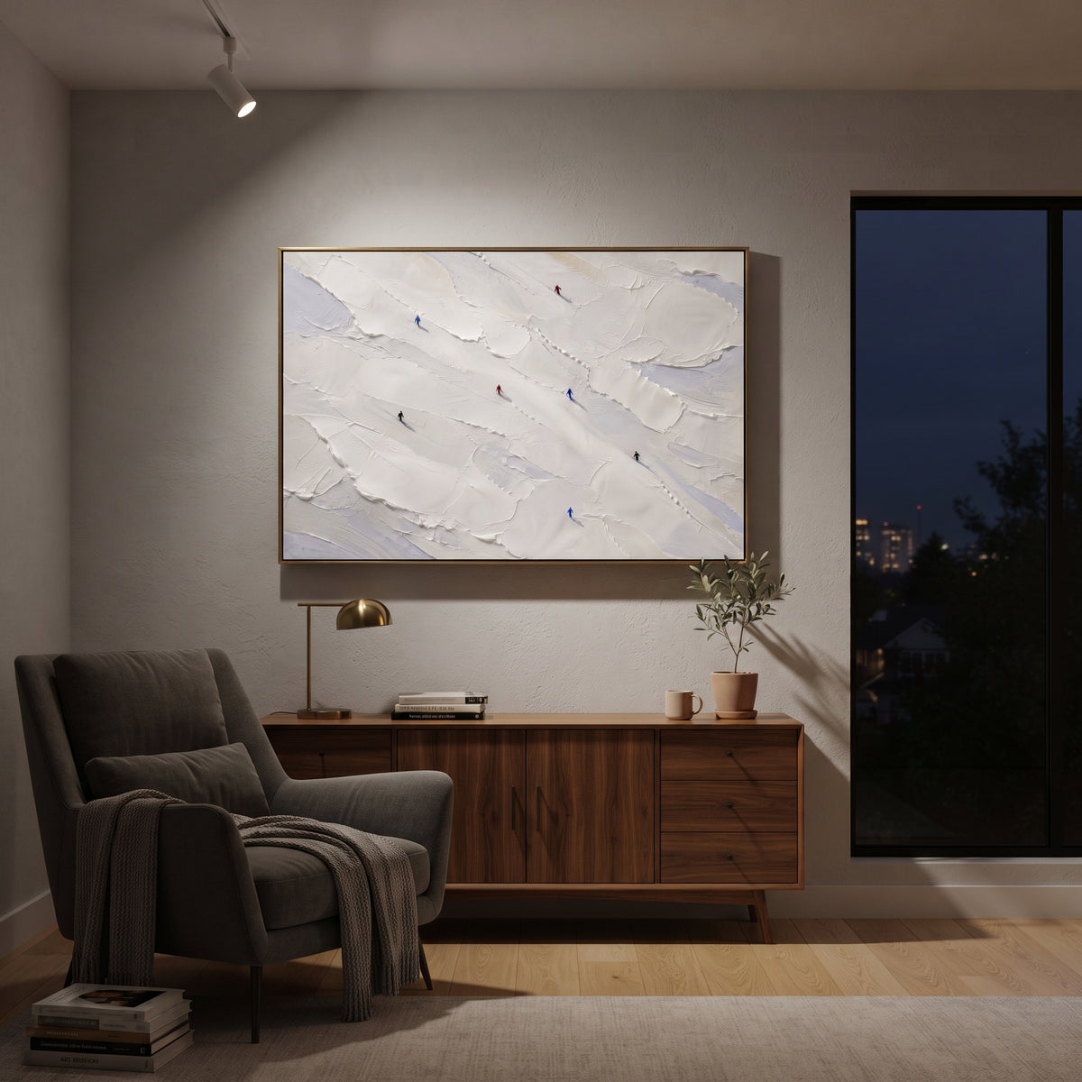 Frosted Pine Slope With Pine Shadows focuses on layered snow ridges, visible ski marks, and a quiet pine border. The artwork shows a winter ski scene built from the actual image: visible downhill figures, curved snow tracks, raised ridgelines, and alpine space arranged in a wide composition. The blue, white, orange palette gives the piece a cold mountain atmosphere while the thick impasto surface creates shadows along each snowbank, ski line, and textured ridge. This is presented as hand-painted