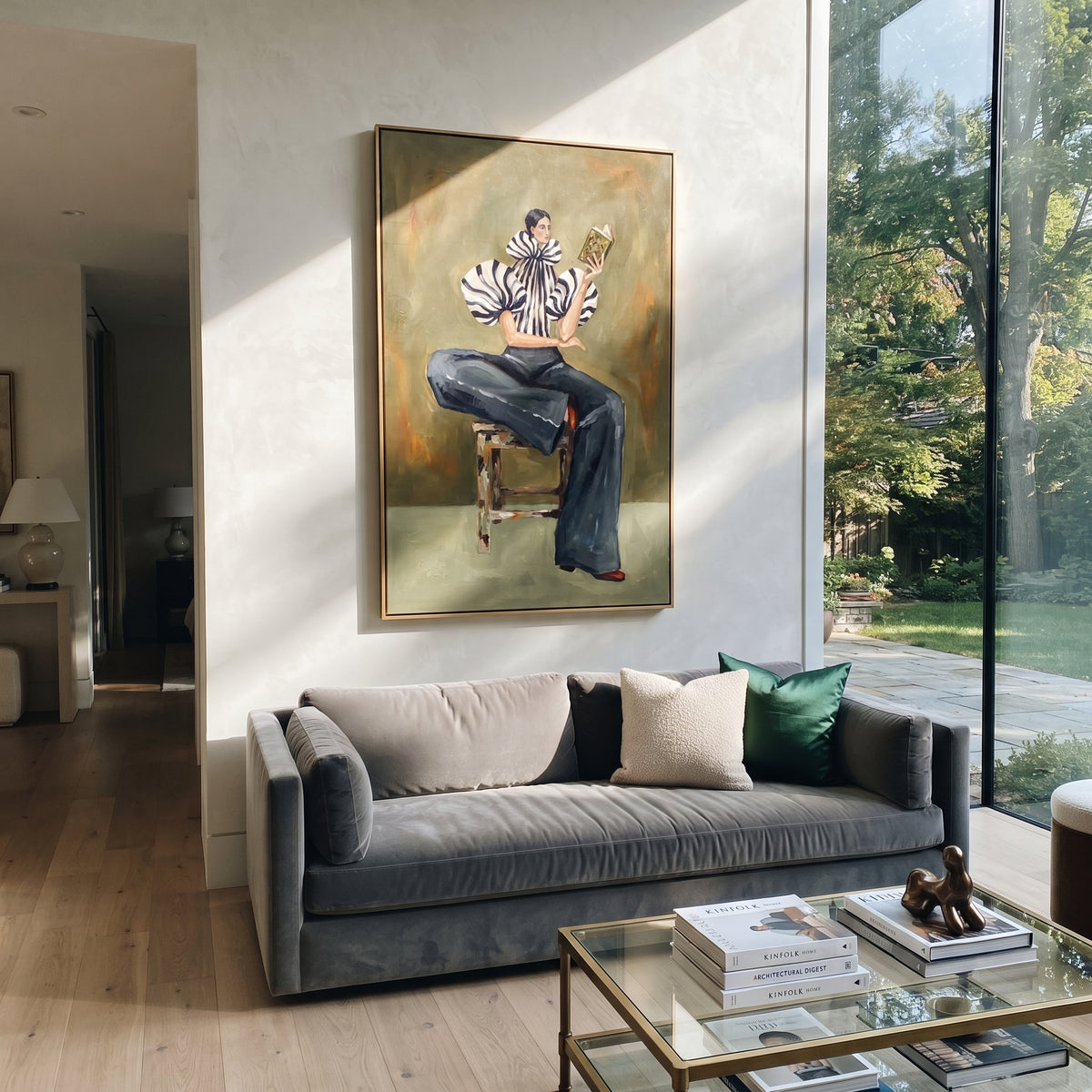 Seated Zebra Sleeve Reader focuses on the specific fashion figure shown in the artwork: seated woman in zebra striped sleeves and dark cropped trousers reading a patterned magazine. The image is built around elongated trousers, a compact upper-body pose, sculptural sleeve volume, small accessory detail, and a quiet studio background. The black, beige, green palette keeps the mood refined while the raised texture and visible brushwork make the surface feel handmade rather than printed. This