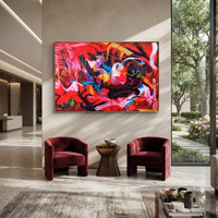 This 100% hand-painted abstract artwork features this hand-painted horizontal canvas features an energetic red abstract composition with sweeping black, white, pink, yellow, blue, and orange gestural brushwork. Layered expressive marks, bold movement, and a slim gold-and-black framed presentation create a vivid contemporary statement for living rooms, offices, creative studios, bedrooms, and modern commercial interiors.