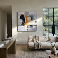 This 100% hand-painted geometric abstract features this hand-painted square canvas presents a square geometric abstract with white and grey blocks, black structure, and sharp golden vertical accents. Layered brushwork, tactile surface detail, and a refined framed presentation create a distinctive statement for living rooms, bedrooms, offices, entries, and modern commercial interiors.
