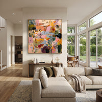 "Bohemian Garden Rhythm Painting" focuses on atmosphere, surface movement, and sculptural heavy impasto craftsmanship rather than a fixed literal storyline. The composition uses this hand-painted square canvas presents a lively bohemian abstract garden with blush pink fields, soft blue passages, ochre marks, deep green brushwork, black dotted accents, and raised palette-knife texture as the visual anchor, while layered palette-knife paint, raised plaster-like texture, and softened brush movement