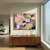 "Blue Pink Bohemian Abstract Painting" focuses on atmosphere, surface movement, and sculptural heavy impasto craftsmanship rather than a fixed literal storyline. The composition uses this hand-painted horizontal canvas presents a colorful bohemian abstract composition with broad pink movement, cornflower blue ground, golden yellow shapes, ivory patches, dark green strokes, and scattered dot details as the visual anchor, while layered palette-knife paint, raised plaster-like texture, and softened