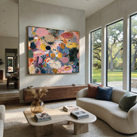 "Spotted Bohemian Color Field Painting" focuses on atmosphere, surface movement, and sculptural heavy impasto craftsmanship rather than a fixed literal storyline. The composition uses this hand-painted horizontal canvas presents a playful bohemian color-field abstract with slate blue ground, pink oval forms, mustard and ochre patches, black spotted motifs, soft cream movement, and expressive impasto brushwork as the visual anchor, while layered palette-knife paint, raised plaster-like texture
