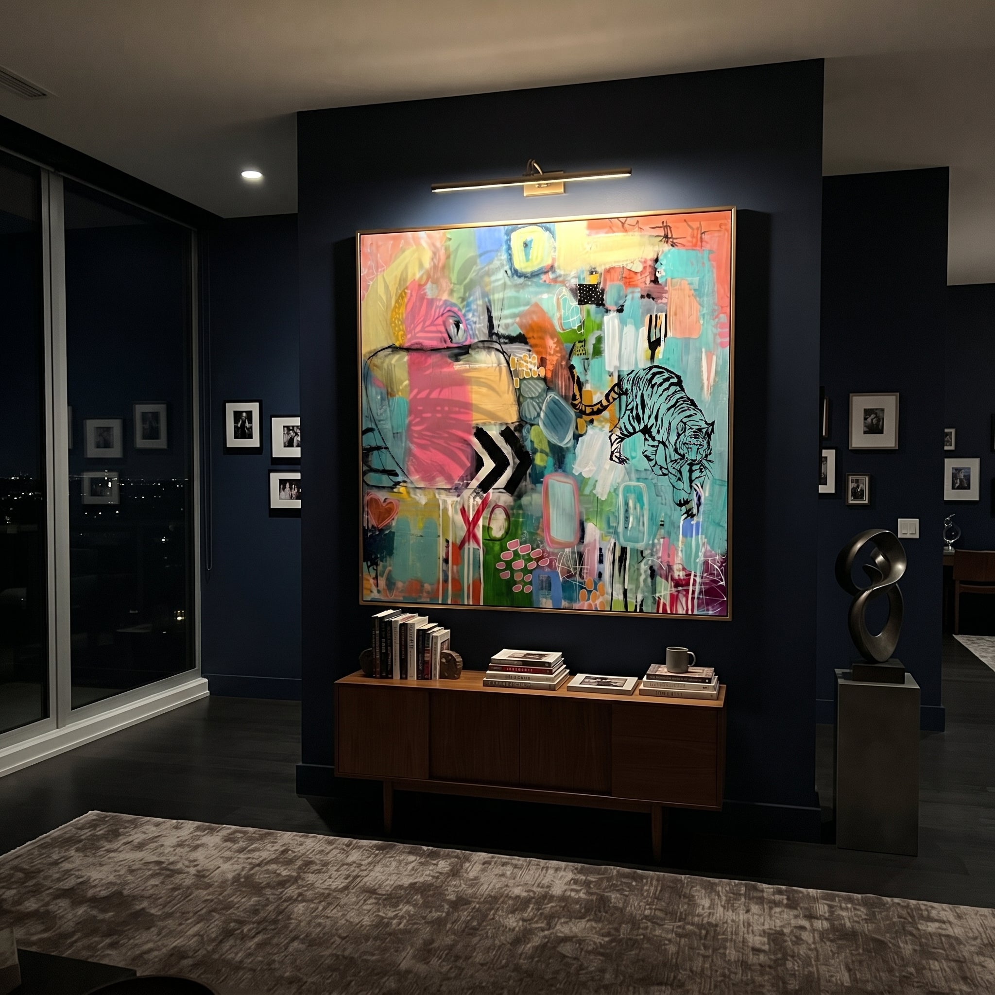 "Bohemian Tiger Pop Abstract Painting" focuses on atmosphere, surface movement, and sculptural heavy impasto craftsmanship rather than a fixed literal storyline. The composition uses this hand-painted square canvas presents a vivid bohemian pop abstract with a black tiger line drawing, turquoise ground, hot pink blocks, lime and yellow passages, graphic marks, and layered urban texture as the visual anchor, while layered palette-knife paint, raised plaster-like texture, and softened brush