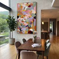 "Lavender Bohemian Garden Painting" focuses on atmosphere, surface movement, and sculptural heavy impasto craftsmanship rather than a fixed literal storyline. The composition uses this hand-painted vertical canvas presents a lavender and pink bohemian garden abstract with sage green leaves, spotted petal forms, ochre stems, cream passages, and thick raised impasto texture as the visual anchor, while layered palette-knife paint, raised plaster-like texture, and softened brush movement create