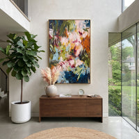 "Deep Garden Bohemian Floral Painting" focuses on atmosphere, surface movement, and sculptural heavy impasto craftsmanship rather than a fixed literal storyline. The composition uses this hand-painted vertical canvas presents a deep green bohemian floral abstract with pale blush blossoms, blue botanical strokes, orange-brown side accents, dark layered foliage, and expressive handmade texture as the visual anchor, while layered palette-knife paint, raised plaster-like texture, and softened brush