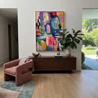 "Bright Bohemian Window Abstract Painting" focuses on atmosphere, surface movement, and sculptural heavy impasto craftsmanship rather than a fixed literal storyline. The composition uses this hand-painted vertical canvas presents a bright bohemian window-like abstract with turquoise arches, hot pink fields, yellow blocks, deep blue structure, red and purple accents, black marks, and expressive layered brushwork as the visual anchor, while layered palette-knife paint, raised plaster-like texture