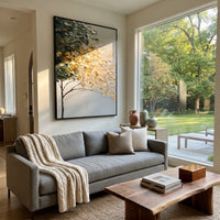 "Golden Cream Tree Canopy Painting" focuses on atmosphere, surface movement, and sculptural heavy impasto craftsmanship rather than a fixed literal storyline. The composition uses this hand-painted vertical canvas shows a slim dark tree trunk supporting a sweeping canopy of deep green, creamy white, and golden leaves, with raised impasto strokes over a calm neutral background as the visual anchor, while layered palette-knife paint, raised plaster-like texture, and softened brush movement create