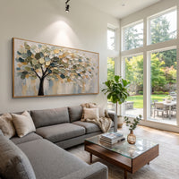 "Cream Gold Tree Canopy Painting" focuses on atmosphere, surface movement, and sculptural heavy impasto craftsmanship rather than a fixed literal storyline. The composition uses this hand-painted panoramic canvas features a soft tree canopy with deep green shadows, cream and golden leaves, fine black branches, a muted grey background, and thick raised palette-knife texture as the visual anchor, while layered palette-knife paint, raised plaster-like texture, and softened brush movement create