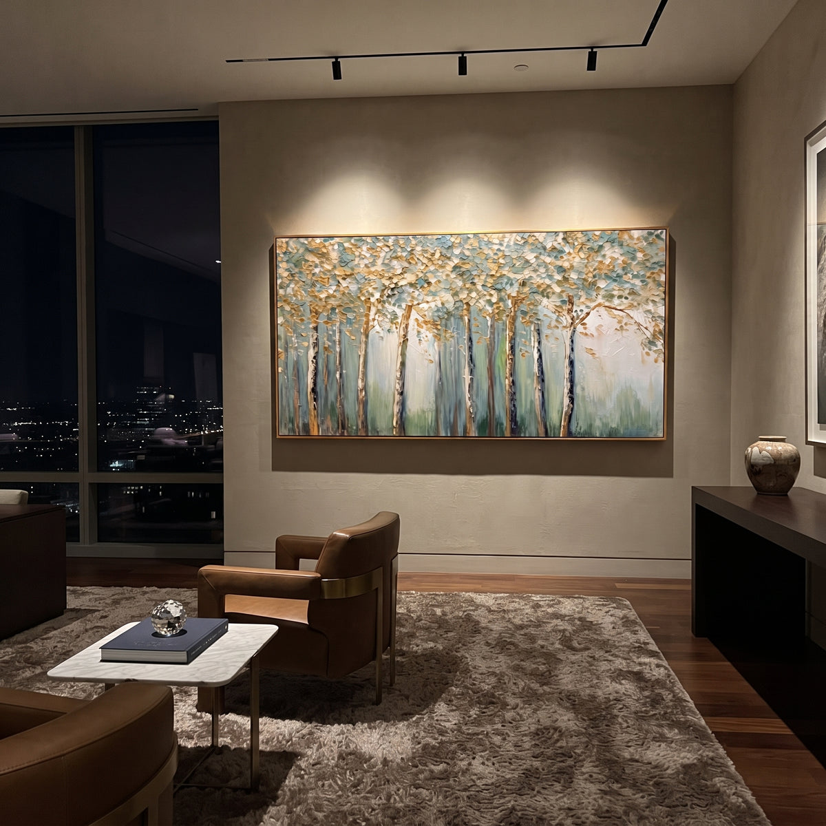 "Blue Gold Birch Forest Painting" focuses on atmosphere, surface movement, and sculptural heavy impasto craftsmanship rather than a fixed literal storyline. The composition uses this hand-painted panoramic canvas presents a panoramic birch forest with slender trunks, blue-green mist, white canopy texture, and warm golden leaf accents, with visible raised palette-knife paint and handmade surface depth as the visual anchor, while layered palette-knife paint, raised plaster-like texture, and