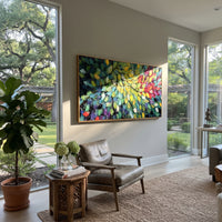 "Colorful Forest Leaves Painting" focuses on atmosphere, surface movement, and sculptural heavy impasto craftsmanship rather than a fixed literal storyline. The composition uses this hand-painted panoramic canvas presents a dense panoramic leaf canopy with emerald green, yellow, red, purple, and blue leaves over dark branch lines, with visible raised palette-knife paint and handmade surface depth as the visual anchor, while layered palette-knife paint, raised plaster-like texture, and softened