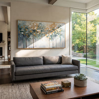 "Misty Abstract Forest Painting" focuses on atmosphere, surface movement, and sculptural heavy impasto craftsmanship rather than a fixed literal storyline. The composition uses this hand-painted panoramic canvas presents a panoramic misty forest with slim dark tree trunks, blue-grey atmosphere, white light, and soft ochre leaf blocks, with visible raised palette-knife paint and handmade surface depth as the visual anchor, while layered palette-knife paint, raised plaster-like texture, and