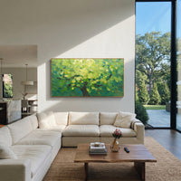 "Fresh Green Canopy Painting" focuses on atmosphere, surface movement, and sculptural heavy impasto craftsmanship rather than a fixed literal storyline. The composition uses this hand-painted panoramic canvas presents a bright panoramic forest canopy filled with fresh lime and emerald green leaves, dark branches, and dense palette-knife texture, with visible raised palette-knife paint and handmade surface depth as the visual anchor, while layered palette-knife paint, raised plaster-like texture